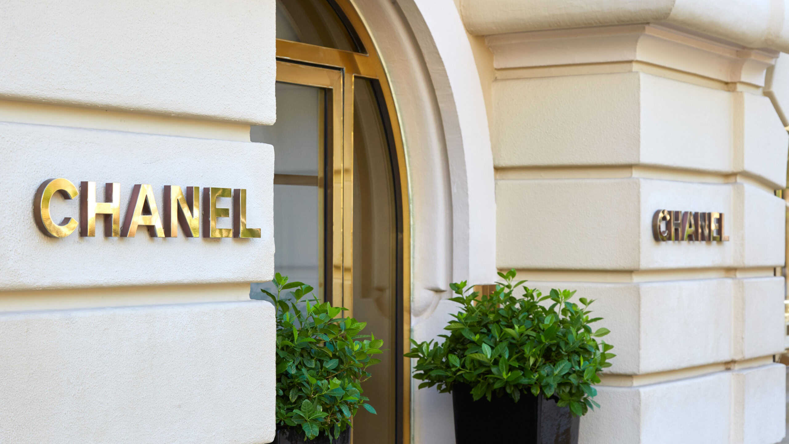 Chanel fashion and jewelry luxury store entrance with golden sign