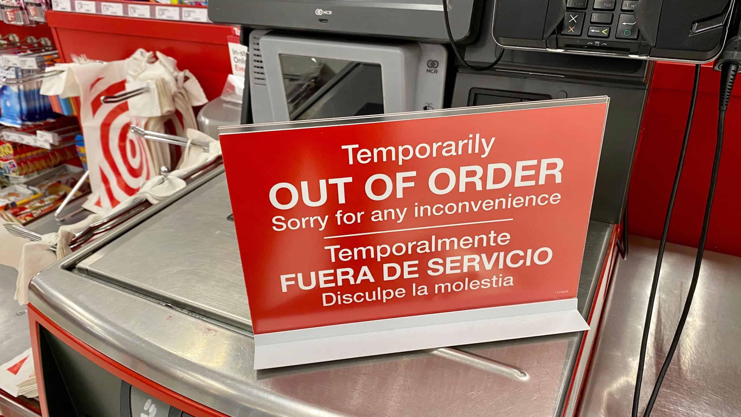 Target store self checkout machine with Temporarily Out of Order sign on it.