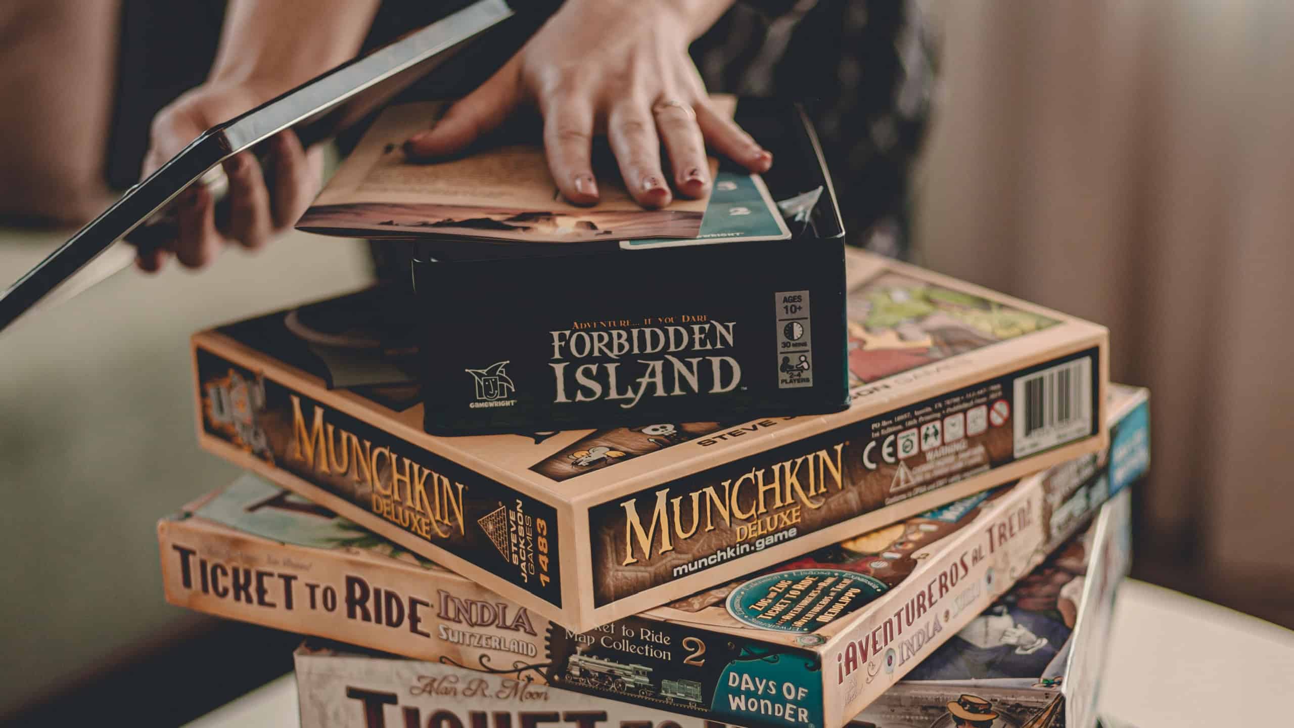 Denver, Colorado, United States. March 31, 2020. Collection of board games. Pick a game to play. Stay at home on quarantine. Coronovirus covid-19 self isolation at home.