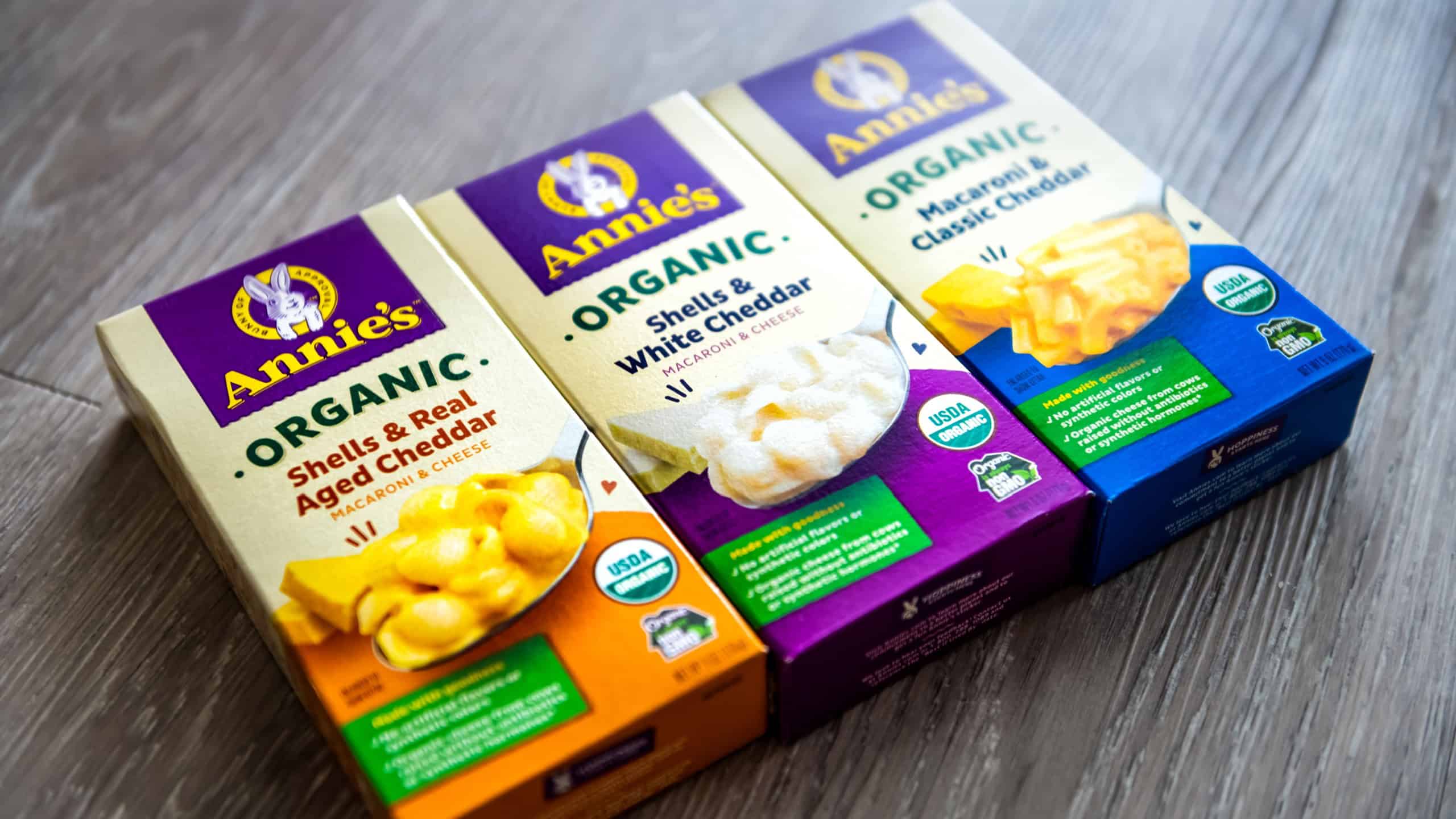 Naples, USA - September 20, 2021: Annie's brand sign closeup of packaged healthy organic mac and cheese macaroni pasta with aged and white cheddar variety label