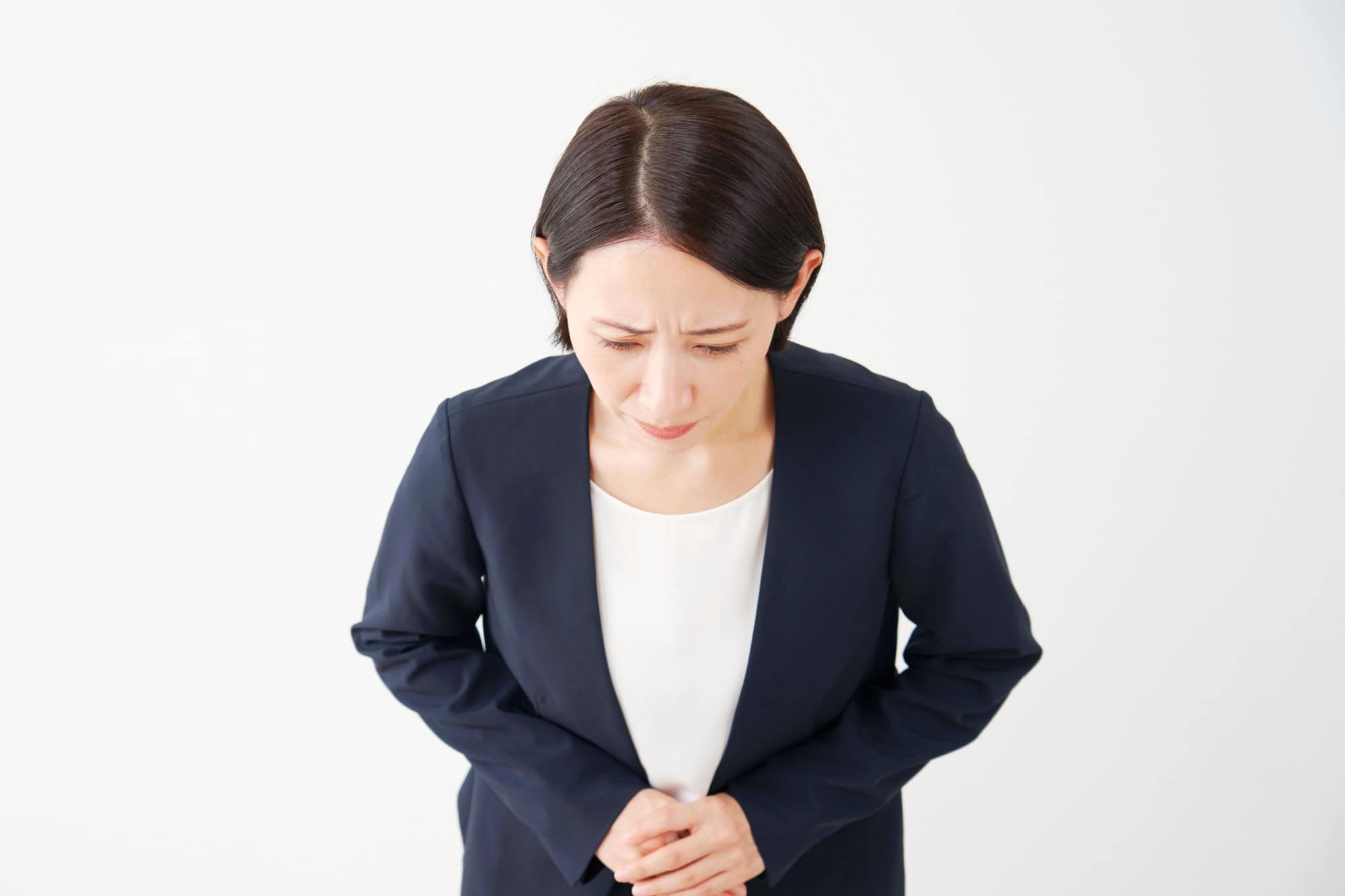 Asian middle aged businesswoman bowing in white background