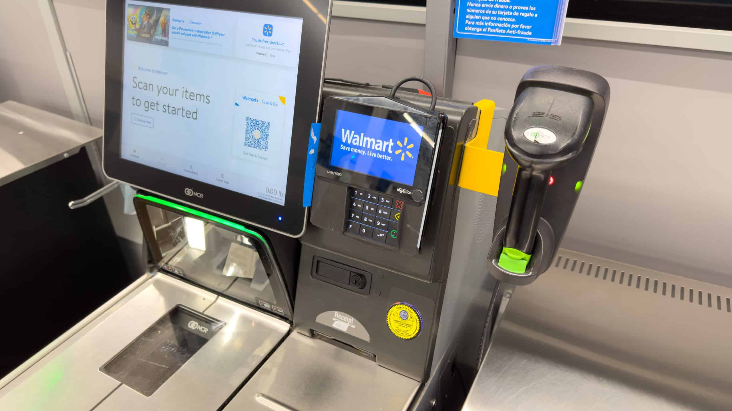 Closeup of a self check out register inside of local Walmart supercenter store.