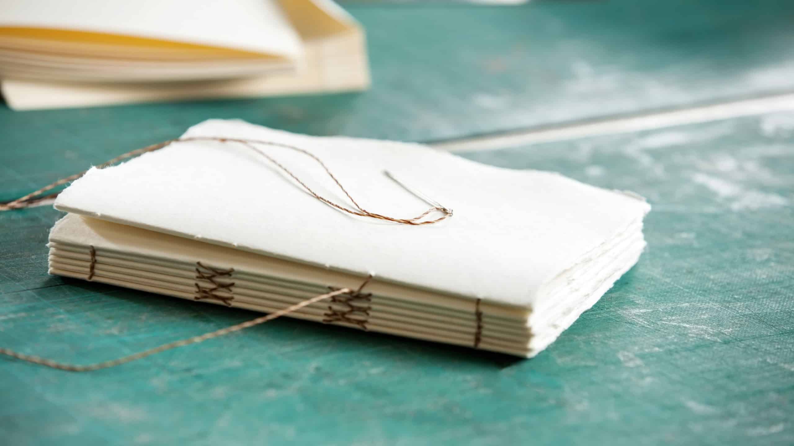 Closeup of thread and papers on table in factory