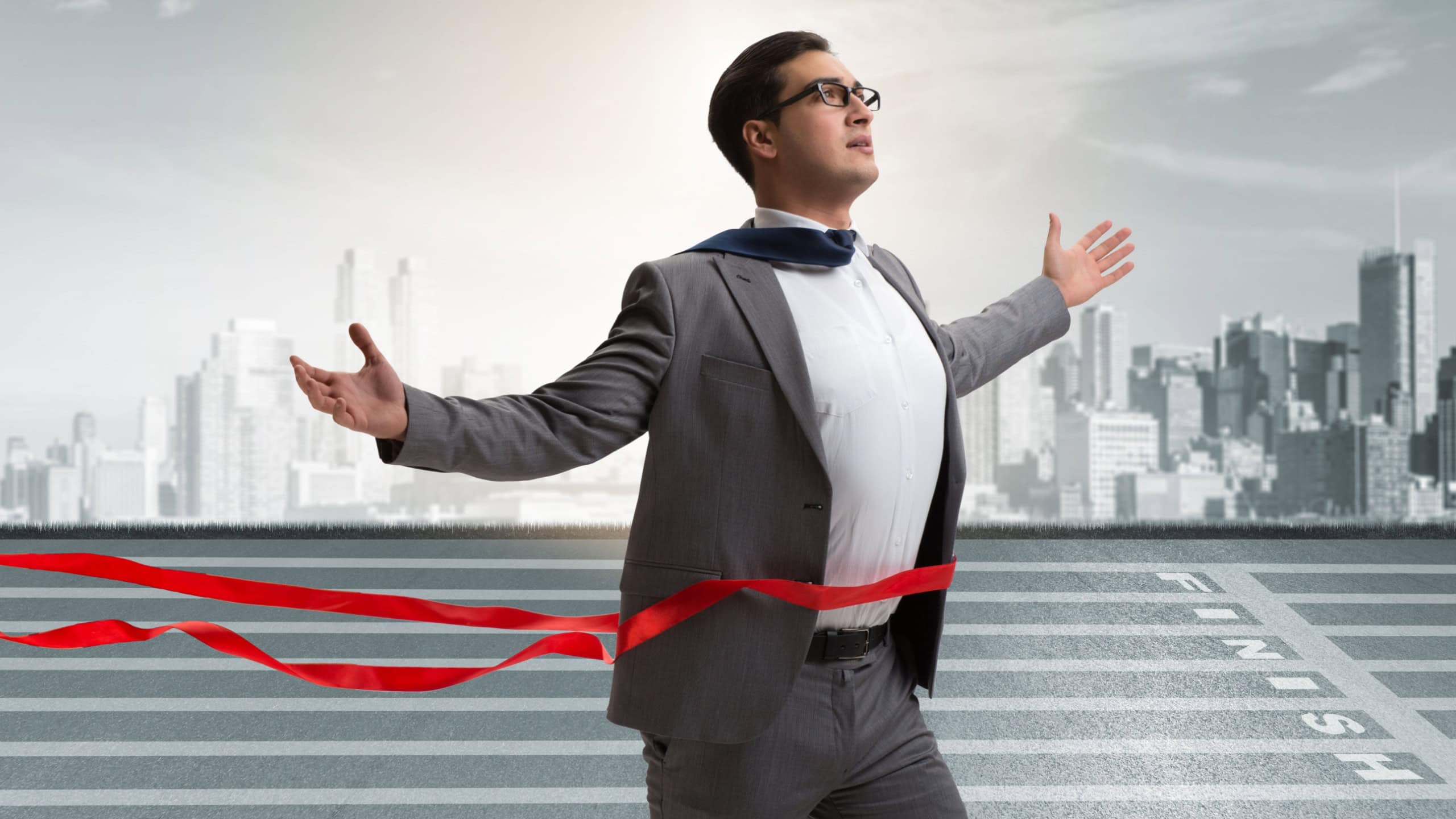 Businessman on the finishing line in competition concept