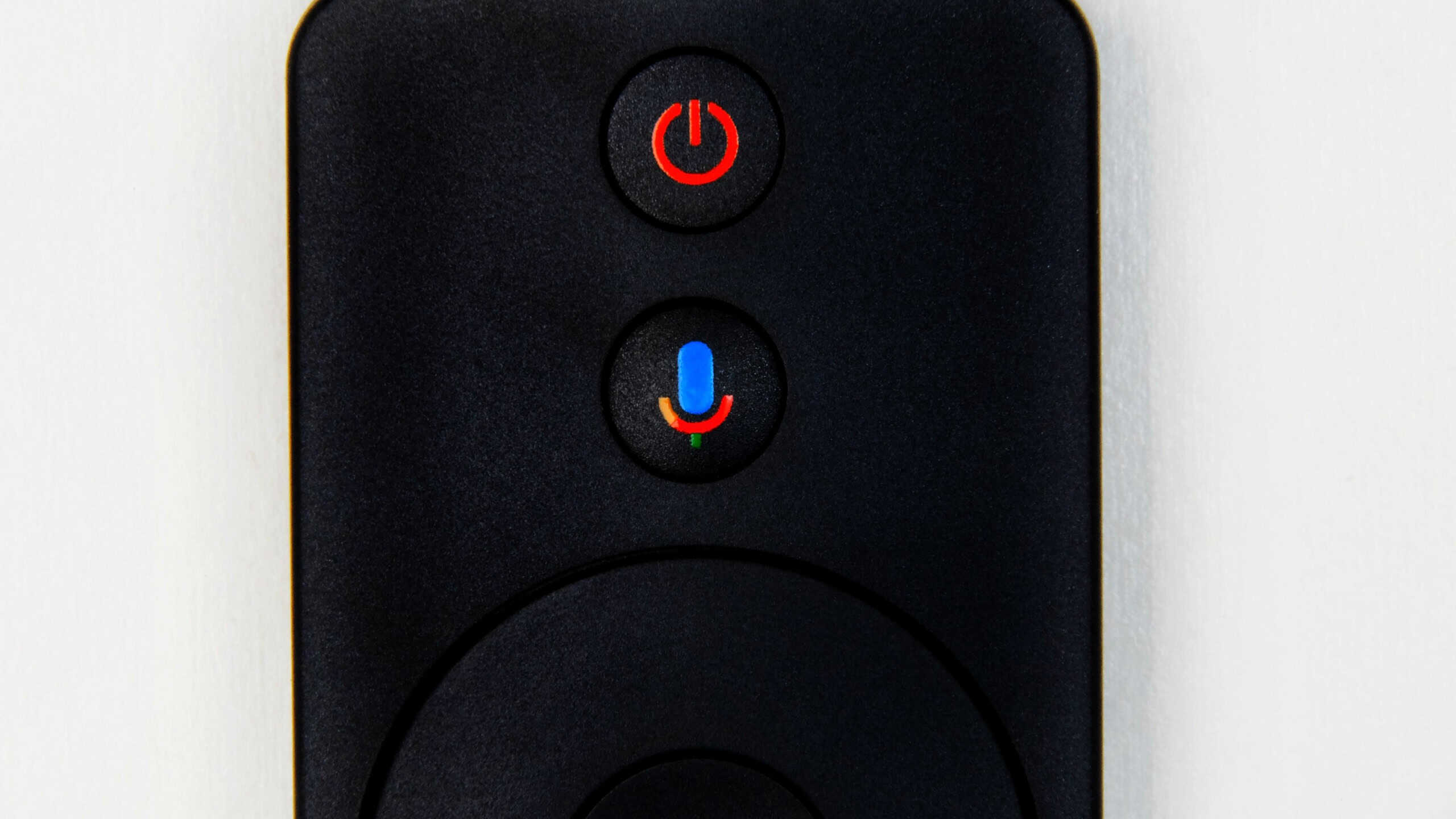 "New York, United States of America- March 13,2019: A close photo of Google Voice Search button on Android TV remote during installation. Google is main system for all Android TV."