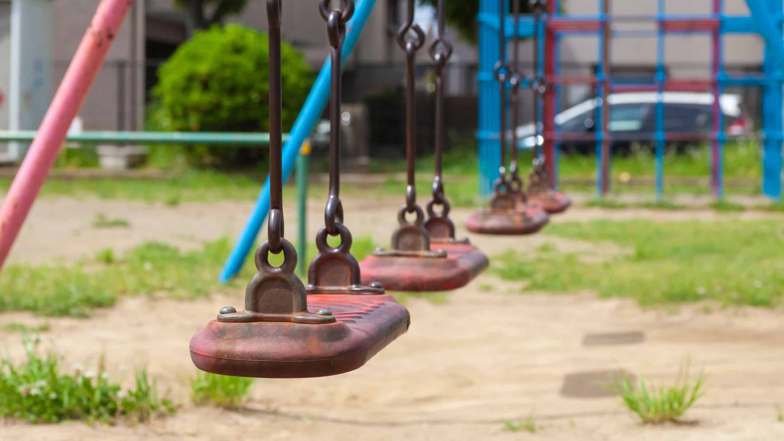 Close - up Empty swings kid at outdoor playground