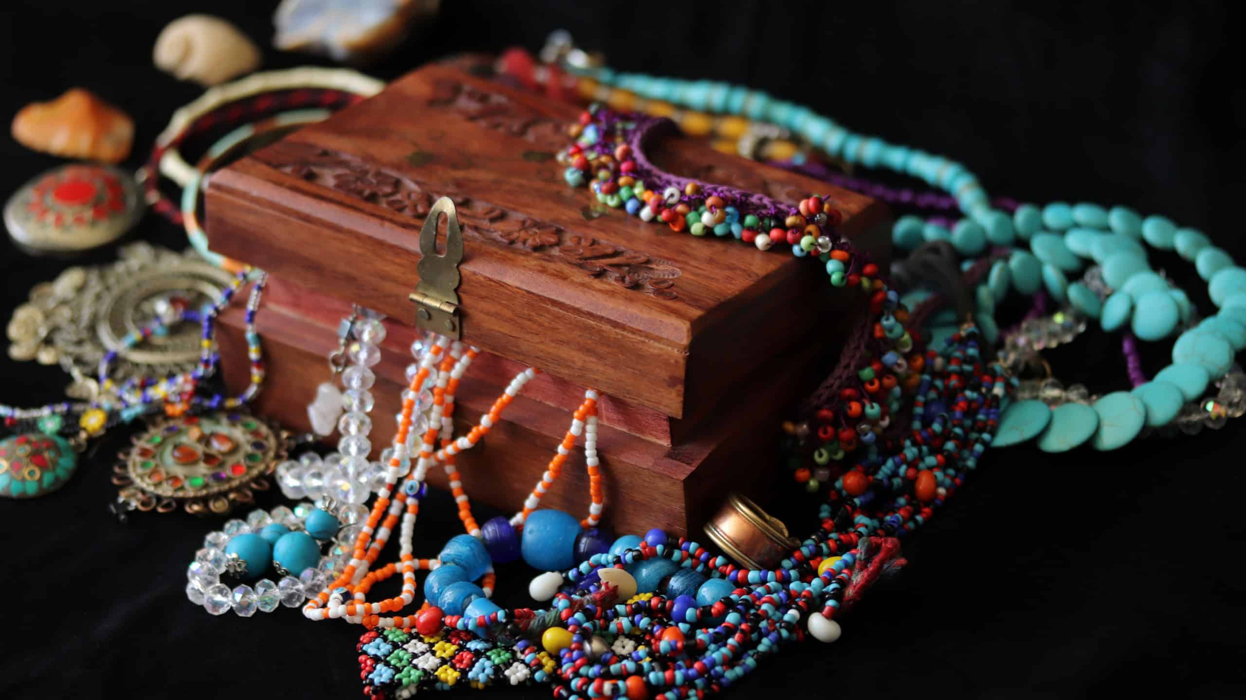 wooden jewelery chest and various jewelries