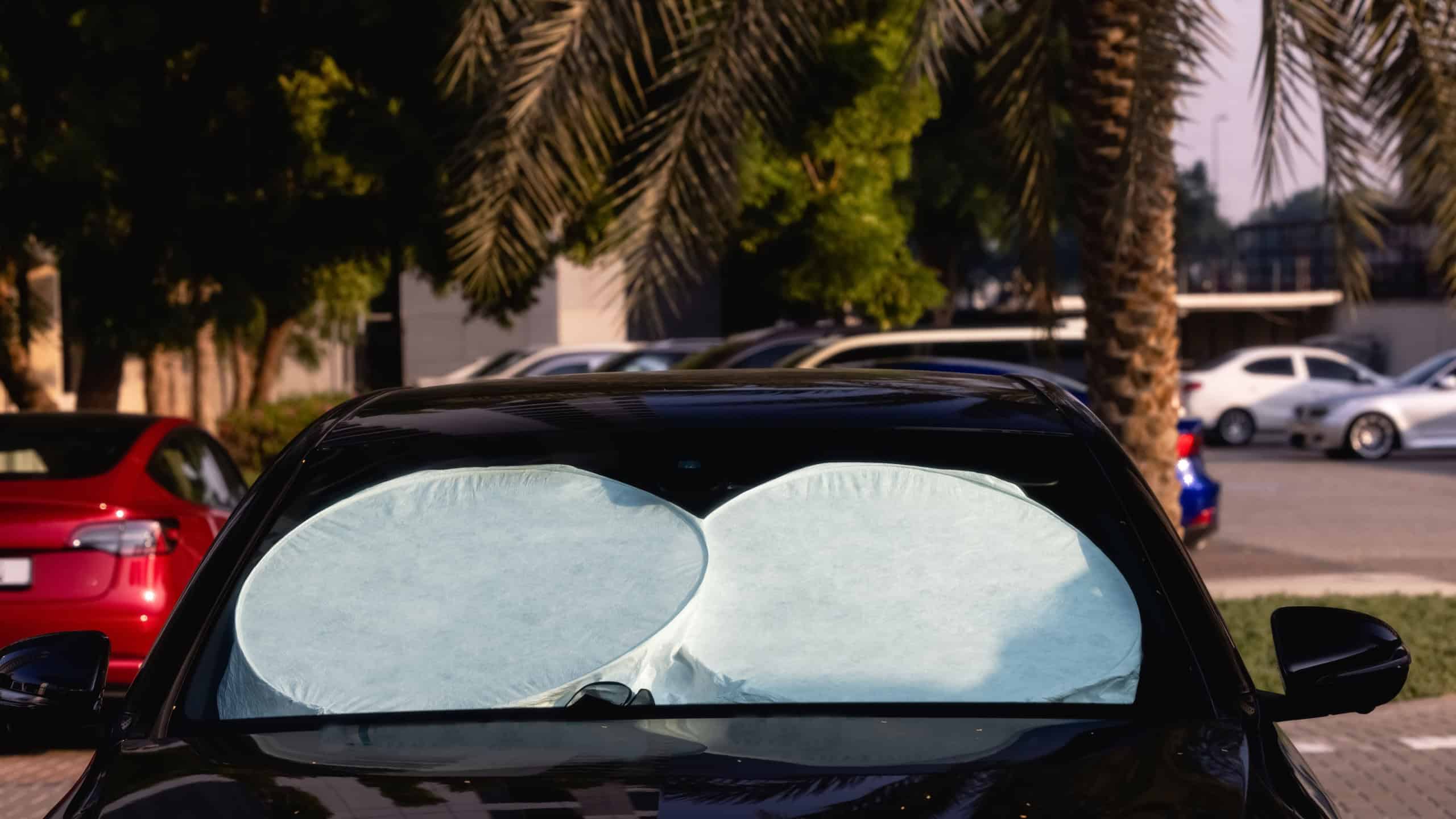 sun shade or sun reflector on the windshield the car Protective reflective surface under the windshield of the passenger car parked on a hot day, heated by the sun's rays inside the ca