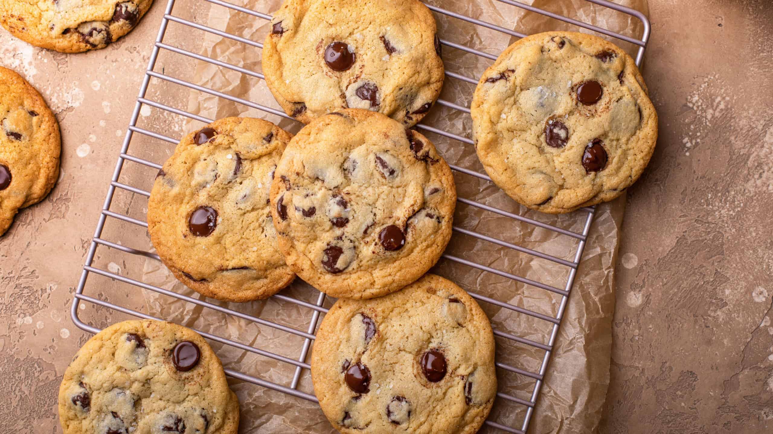 Chocolate chip cookies with flaky salt on a cooling rack, homemade freshly baked cookies