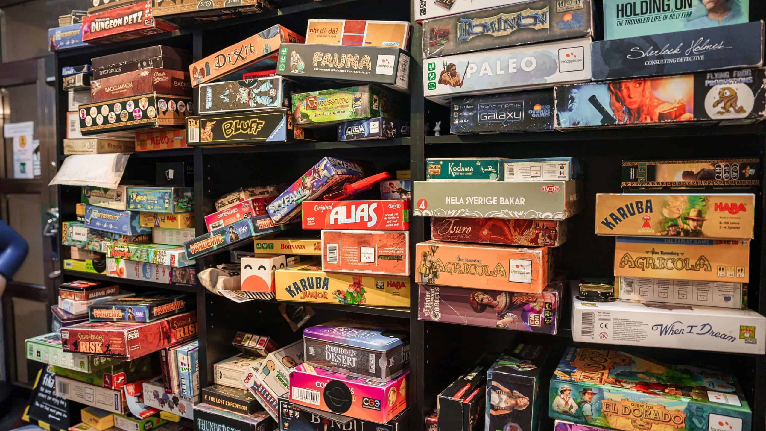 Gothenburg, Sweden. March 30, 2023. Several type colourful board game boxs on the shelves of games cafe for customer to play or buy, number of players growing everyday