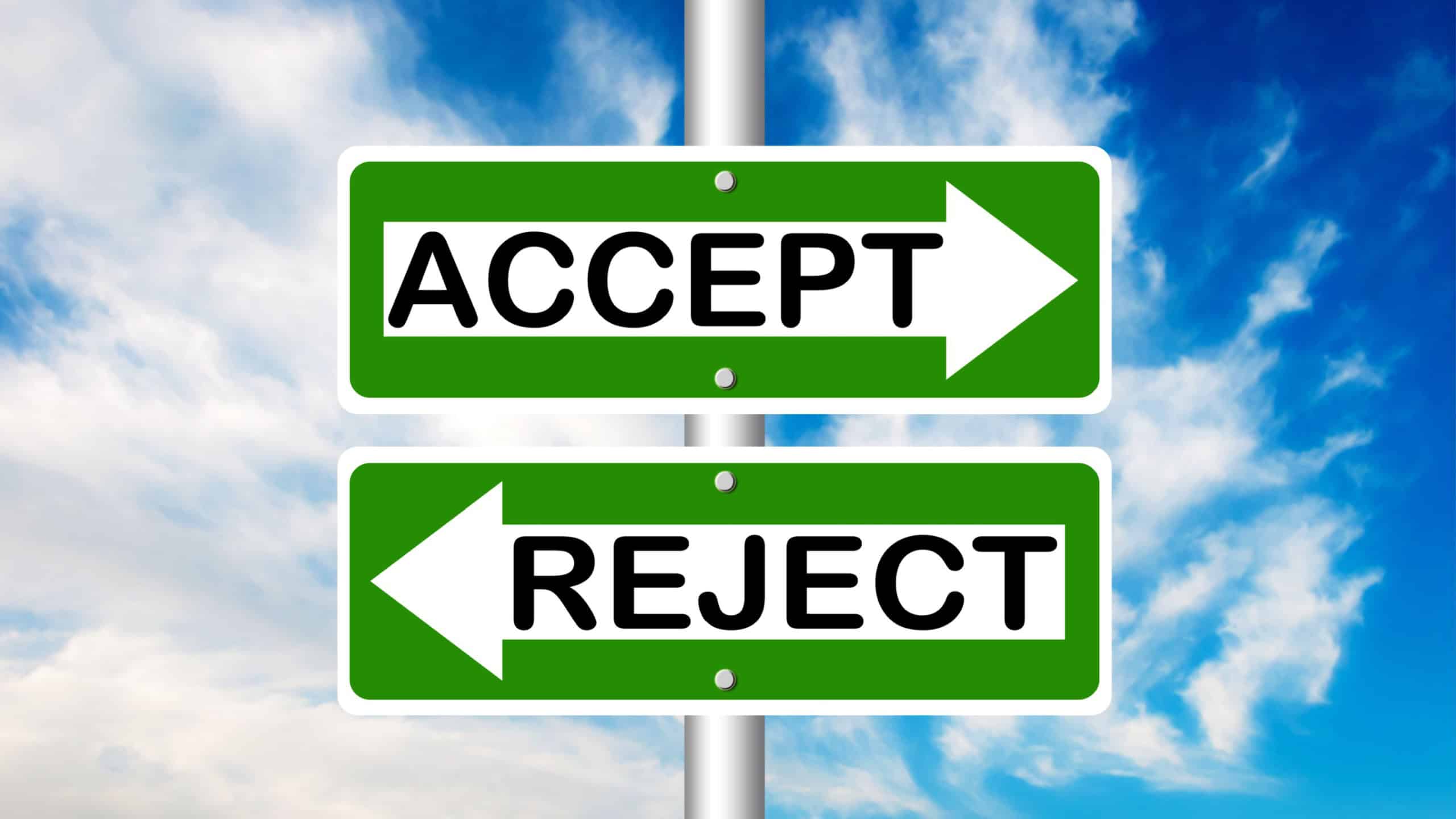 Accept and Reject two way road sign with a blue sky in a background