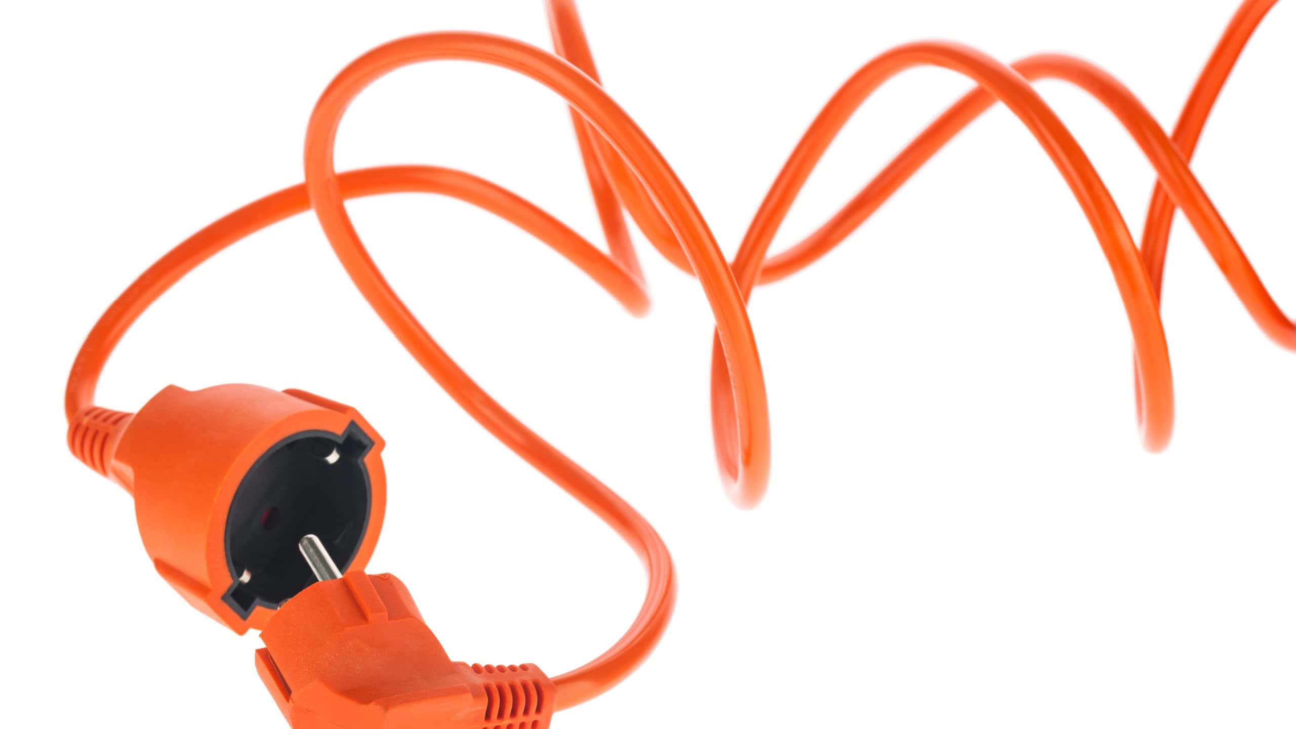 Orange electrical extension cord isolated on white background. Detail for design. Design elements. Macro.