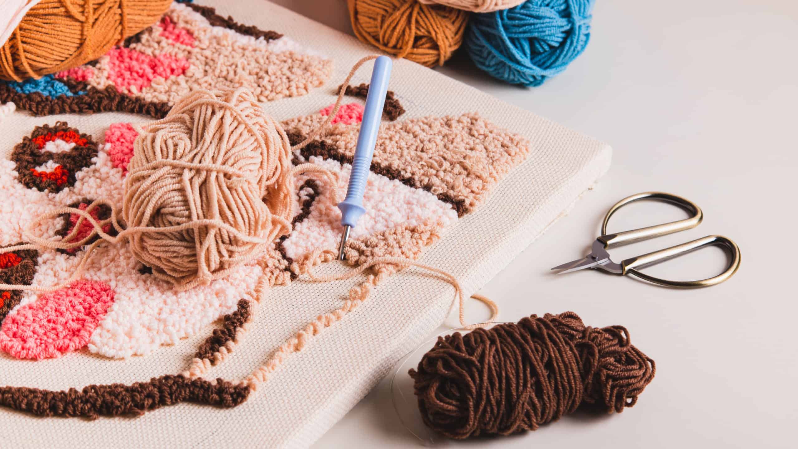 Punch needling kit, threads, canvas and needle for handmade crafts on the table