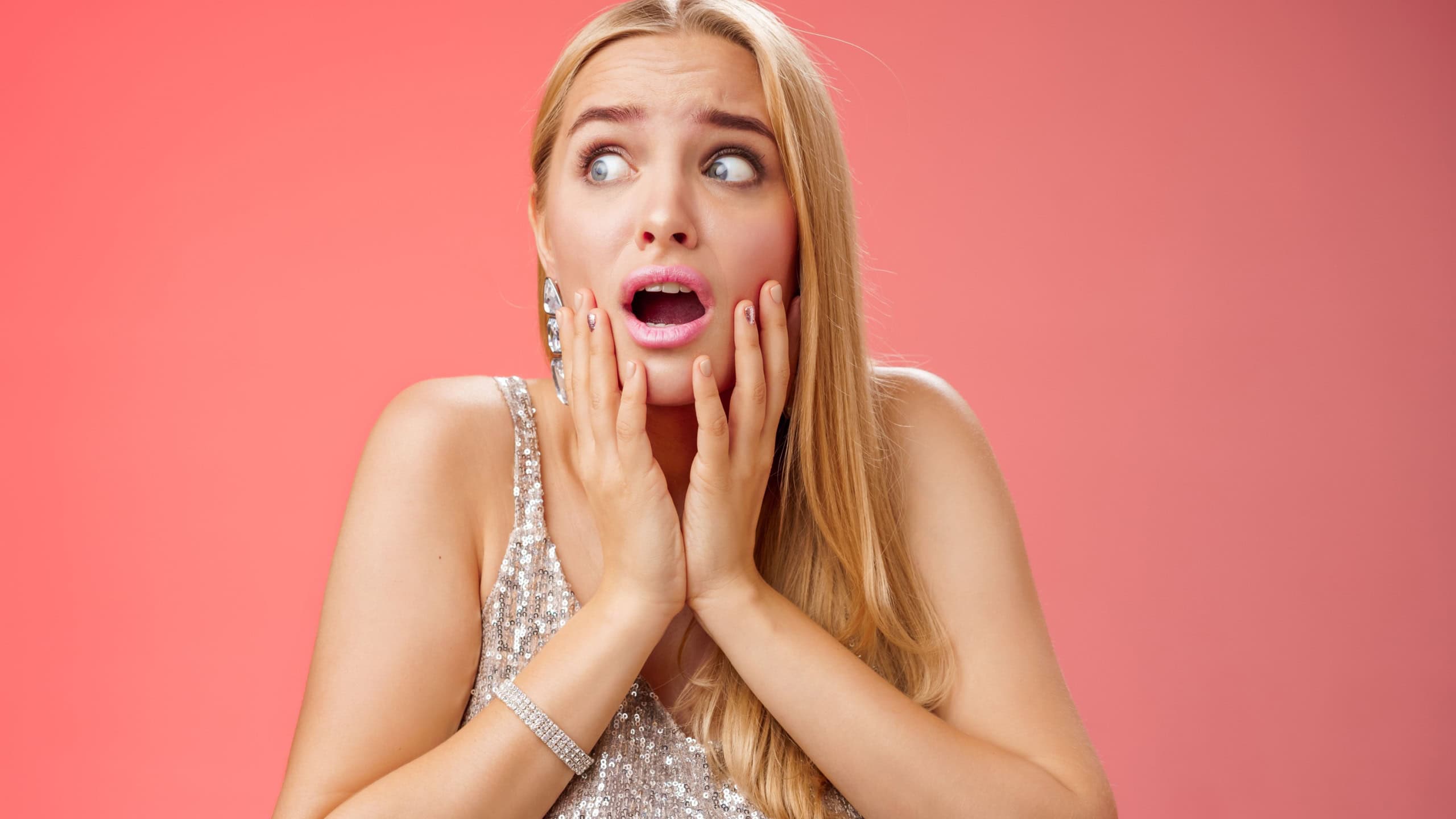 Afraid girl panic look left scared trembling fear insecure touching cheeks helpless stare sideways grimacing gasping frightened nervously waiting help, standing concerned red background