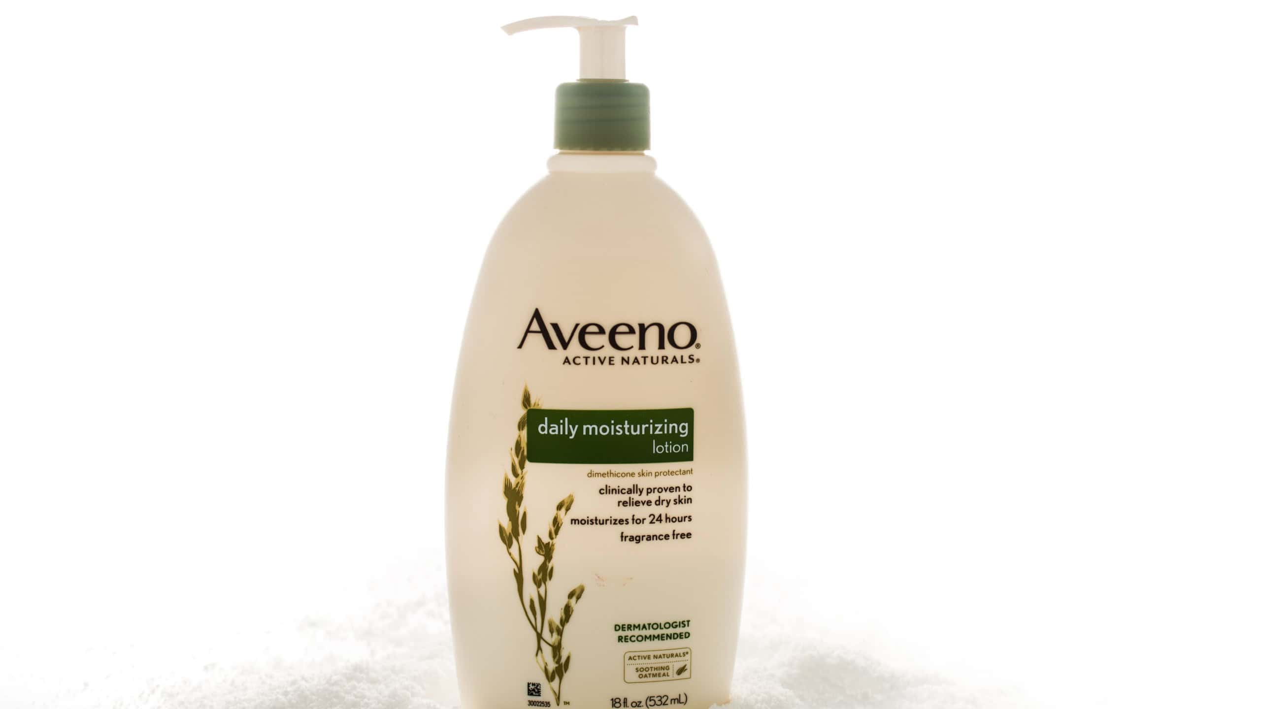 Winneconne, WI -31 January 2015: Bottle of Aveeno daily moisturizing lotion that claims works for 24 hours. Company was created in 1945.