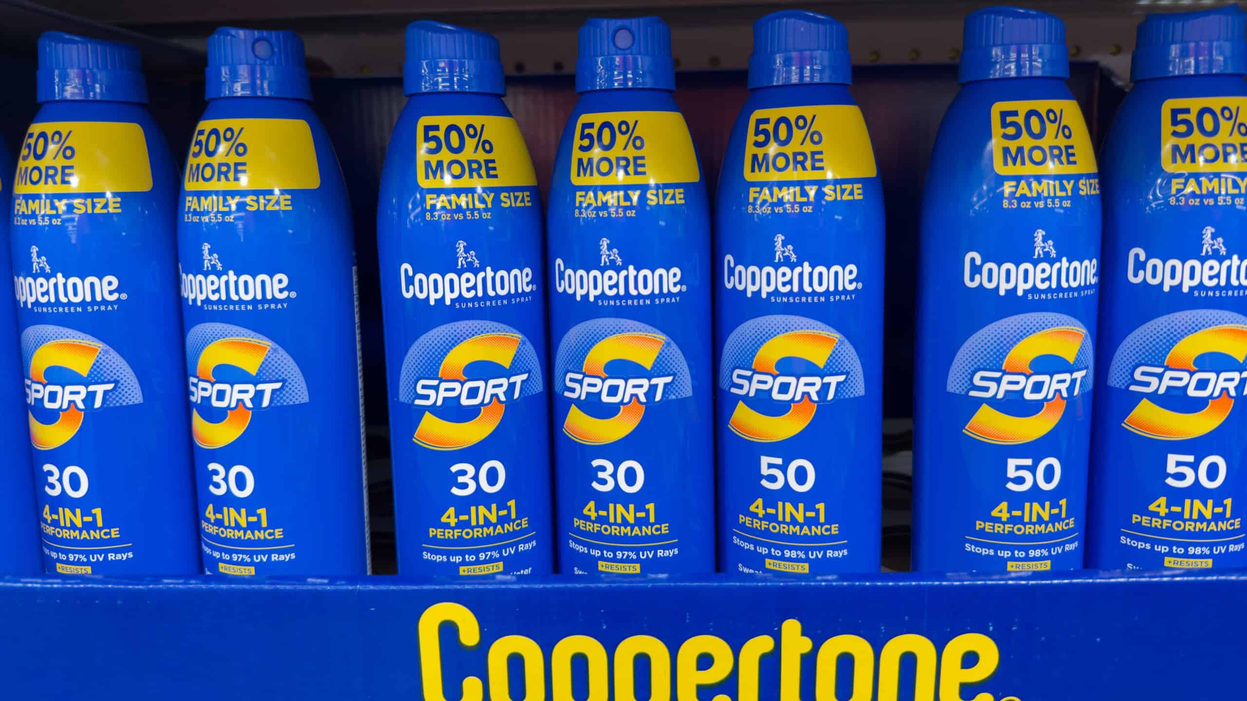 Charlotte, NC - June 14, 2025: Coppertone Sport Sunscreen Spray Bottles on Store Shelf.