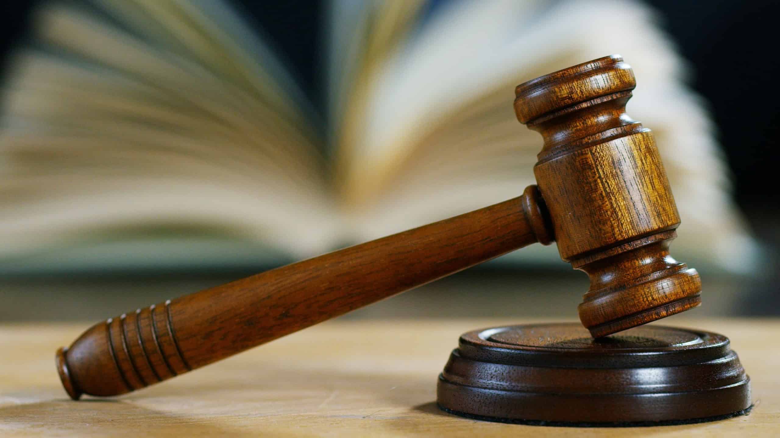 hand shake auction or scene of lawyers or notaries with gavel judge for the insurance compensations. concept of law and lawyer, judiciary and legislature applied to the democratic law.