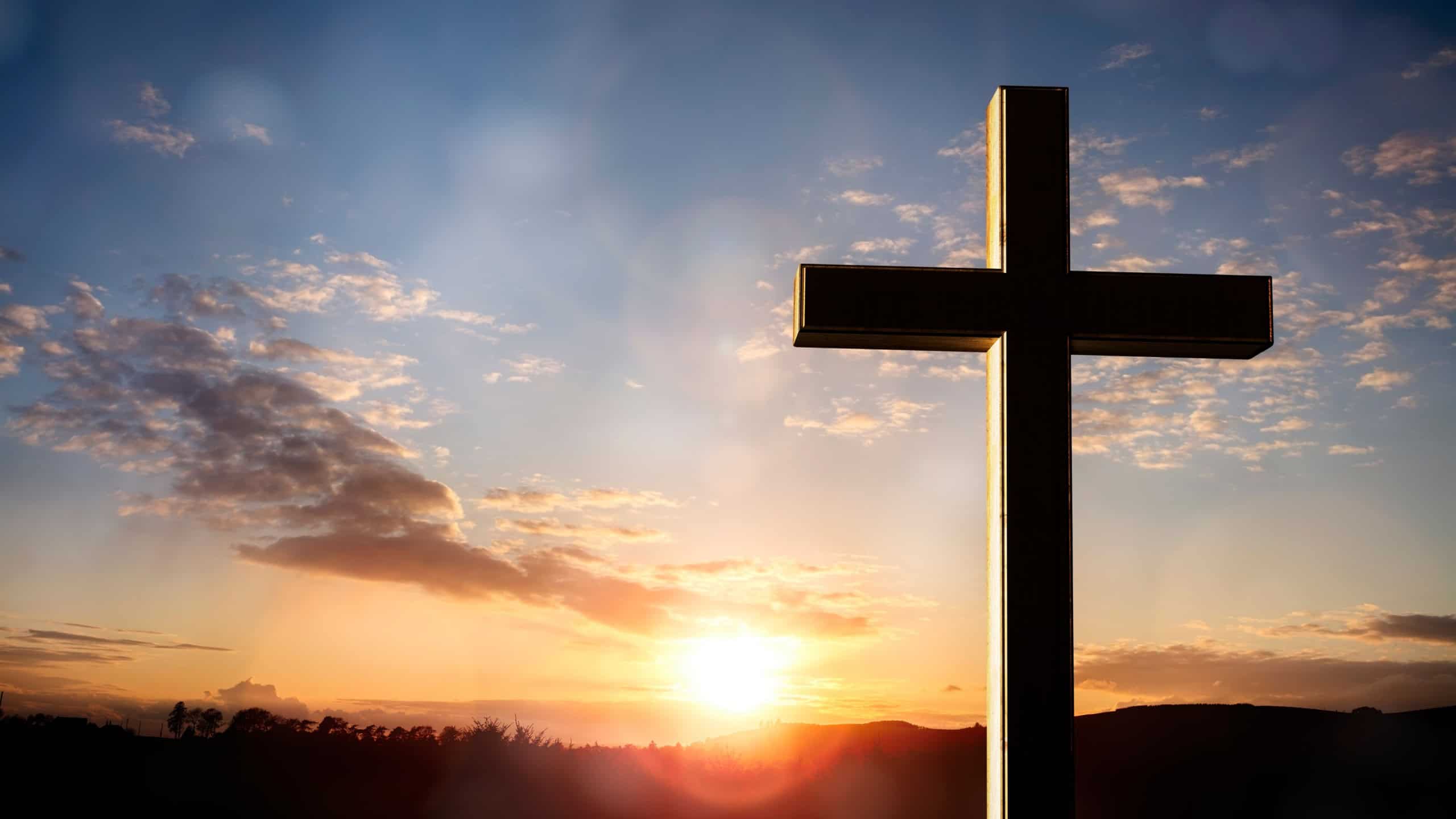 Cross at sunset, crucifixion of Jesus Christ