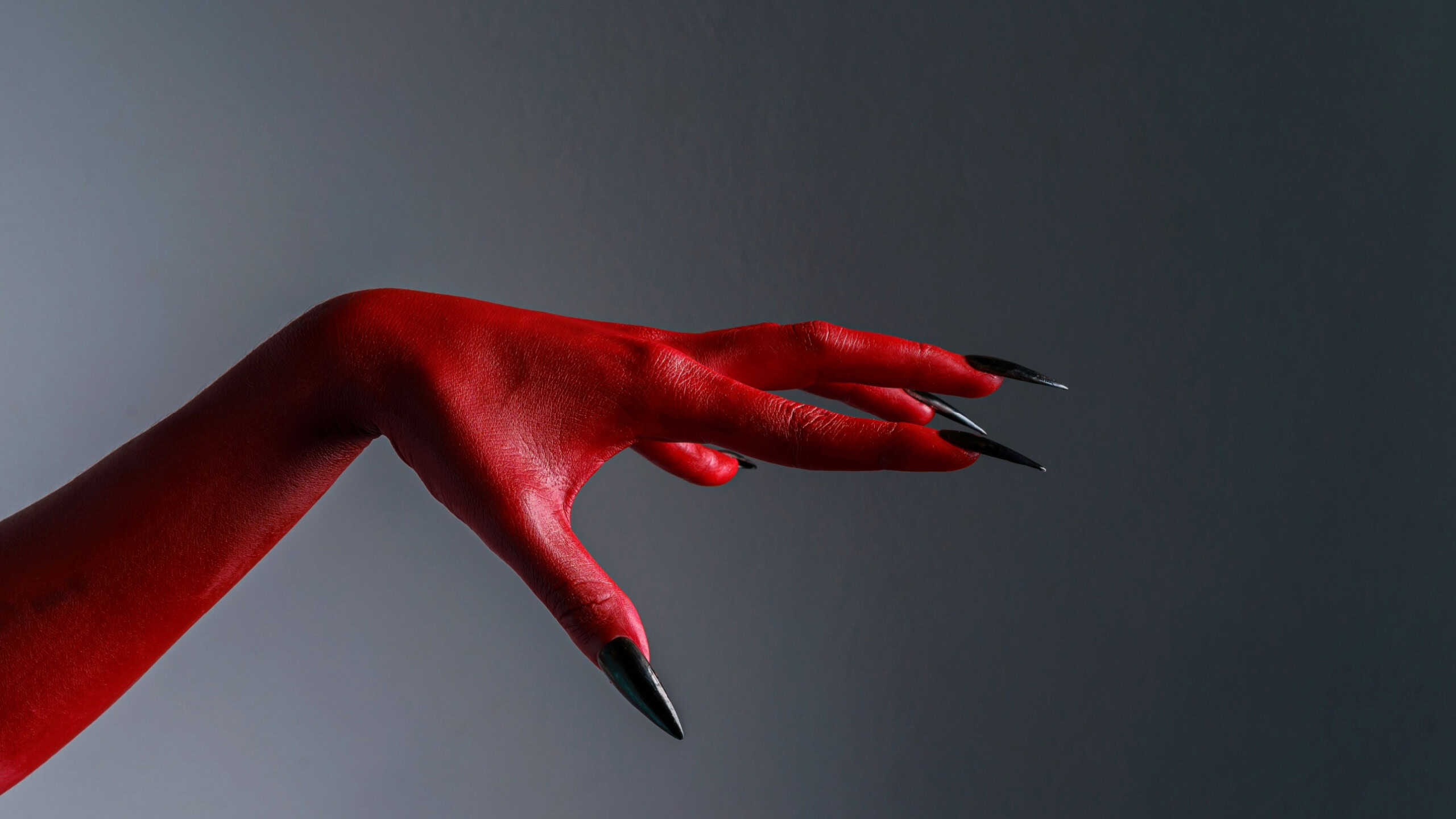 Scary female monster hands halloween character red color isolated background.