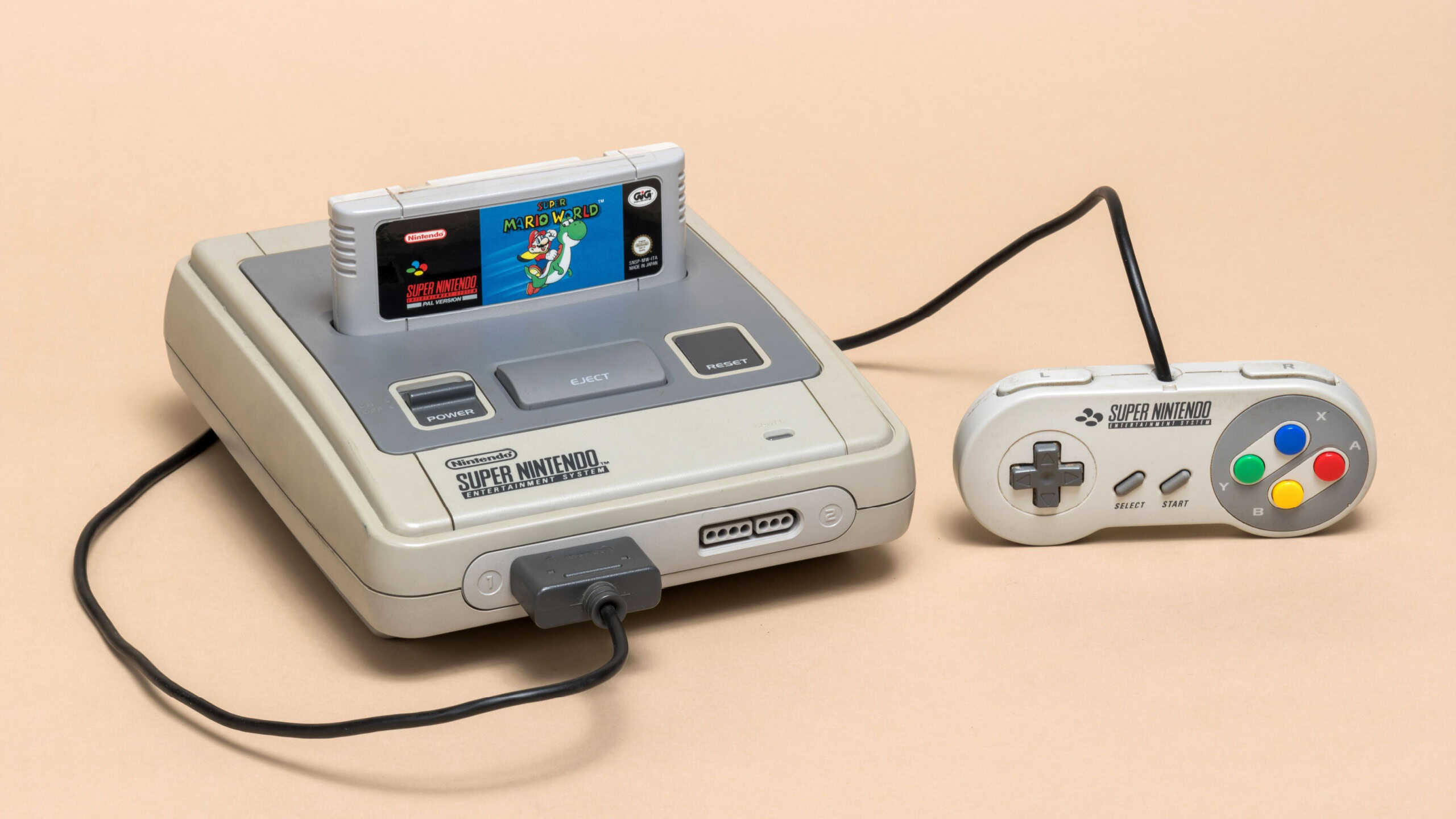 Pavia, Lombardy, Italy - November 23, 2024: Super Nintendo Entertainment System from 1990 at Ctrl+Alt Museum. Abbreviated in Super NES or Super Nintendo.