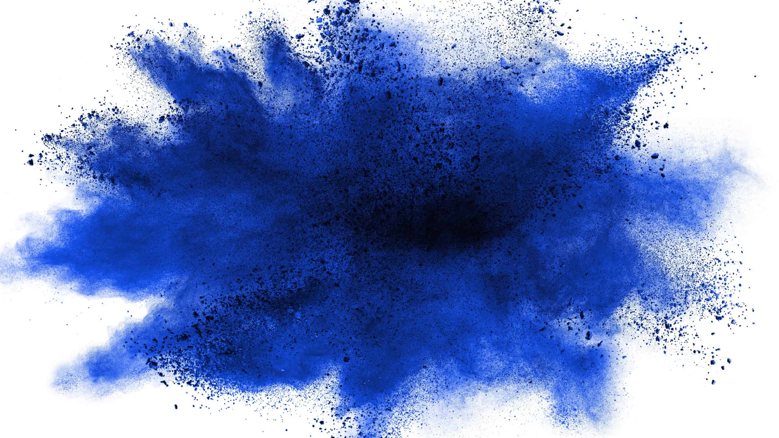 Blue powder explosion on white background. Colored cloud. Colorful dust explode. Paint Holi.