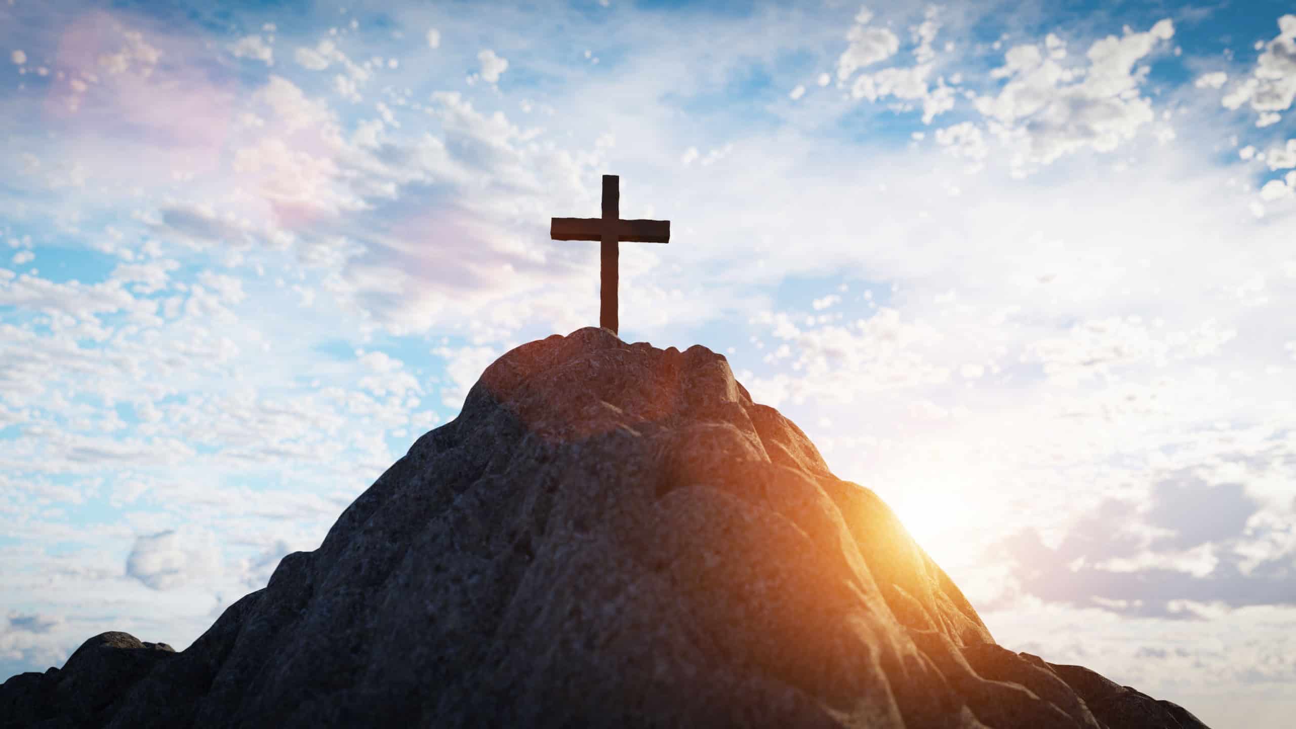 Cross on mountain peak at sunset religion and faith. Christian symbol. 3D illustration