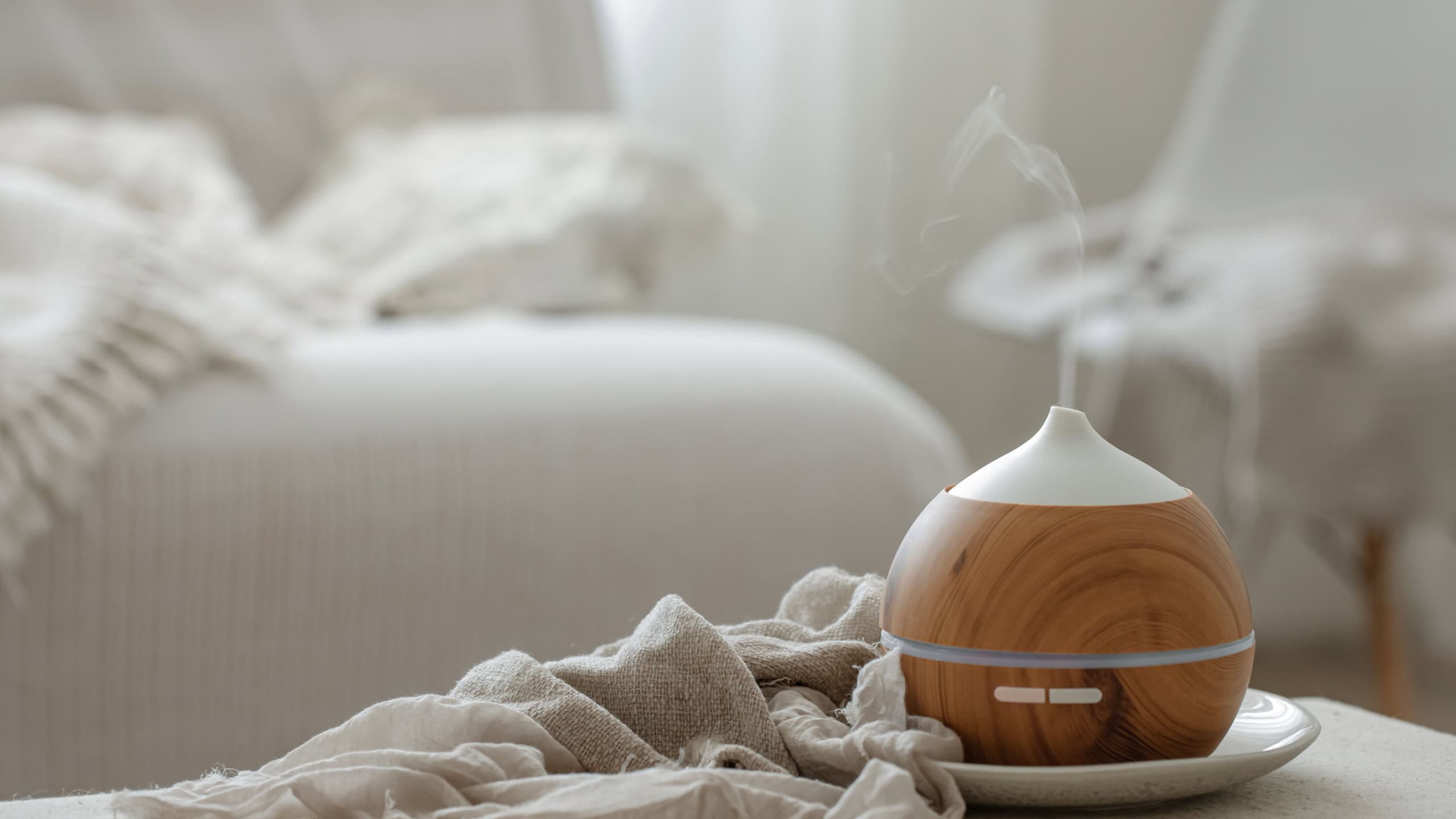 Essential oil aroma diffuser humidifier diffusing water articles in the air.