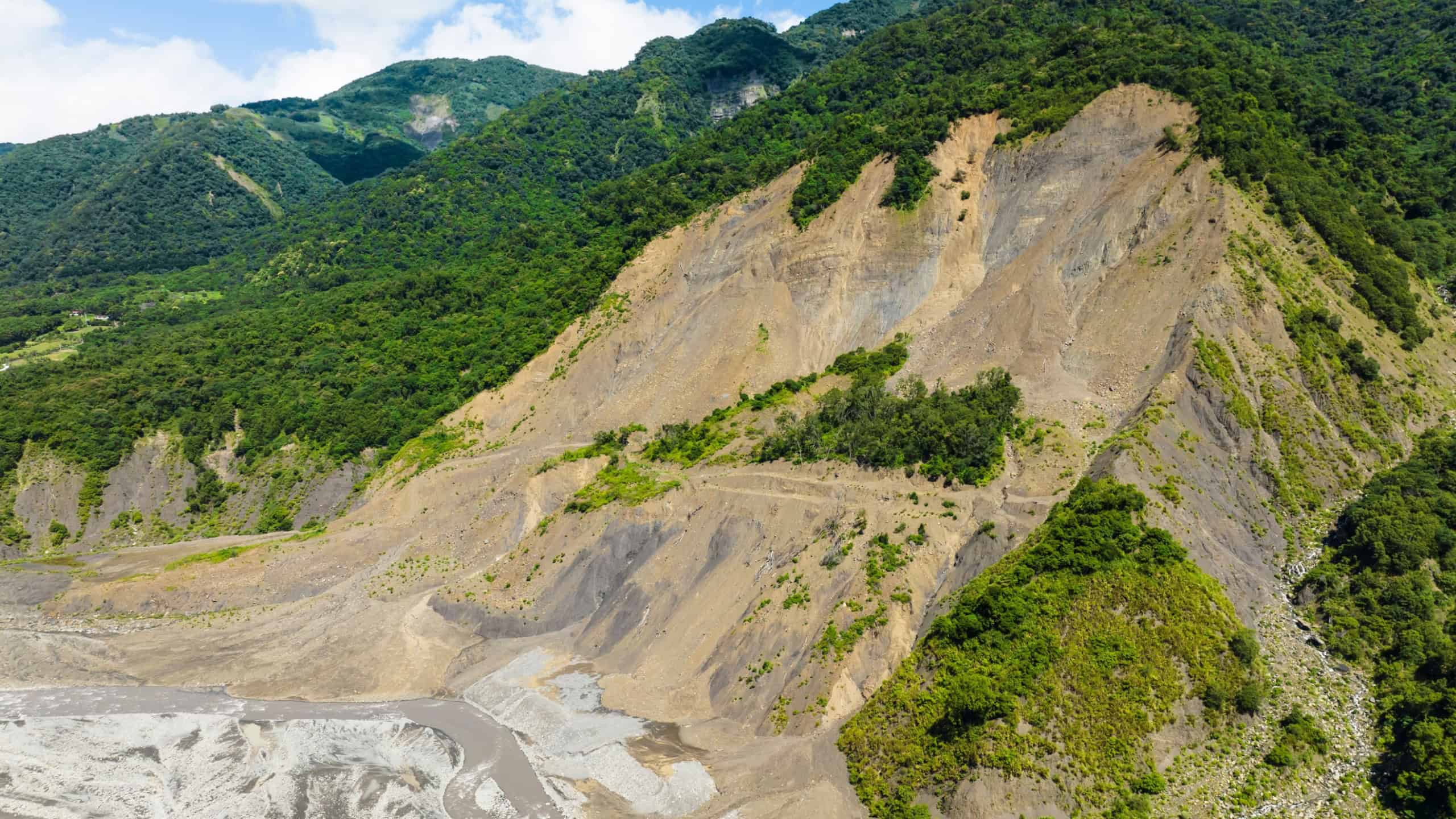 Aerial view of Landslides and rockfalls on the road in the mountains