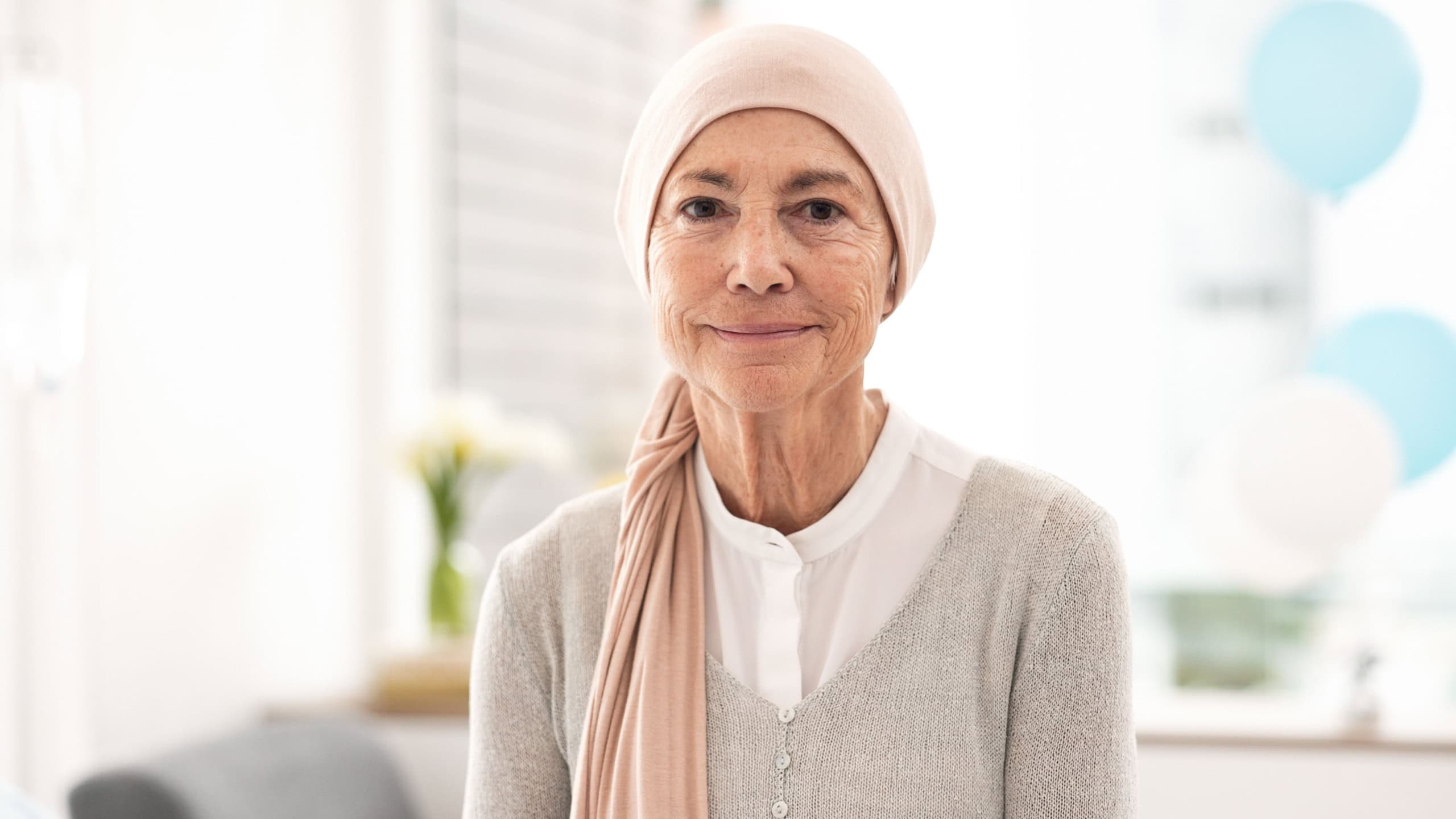 Face, senior woman and cancer patient in hospital for healthcare, wellness and healing. Serious portrait, elderly and sick person in clinic with courage mindset to fight for health in retirement