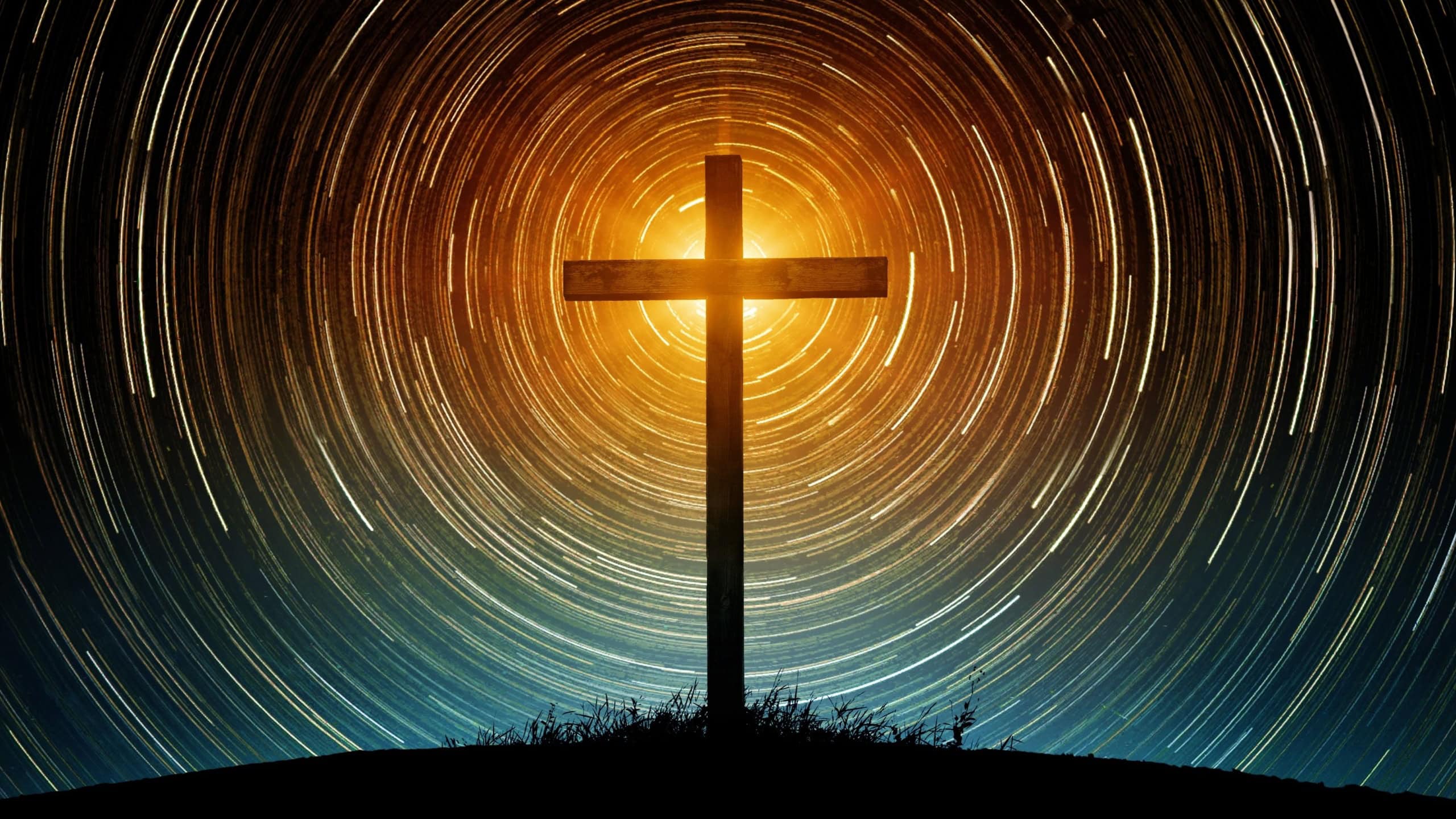 The silhouette of the cross as a symbol of the Christian religion against the background of the night sky with tracks of stars. Concept on the theme of God, paradise, religion, Christian faith.