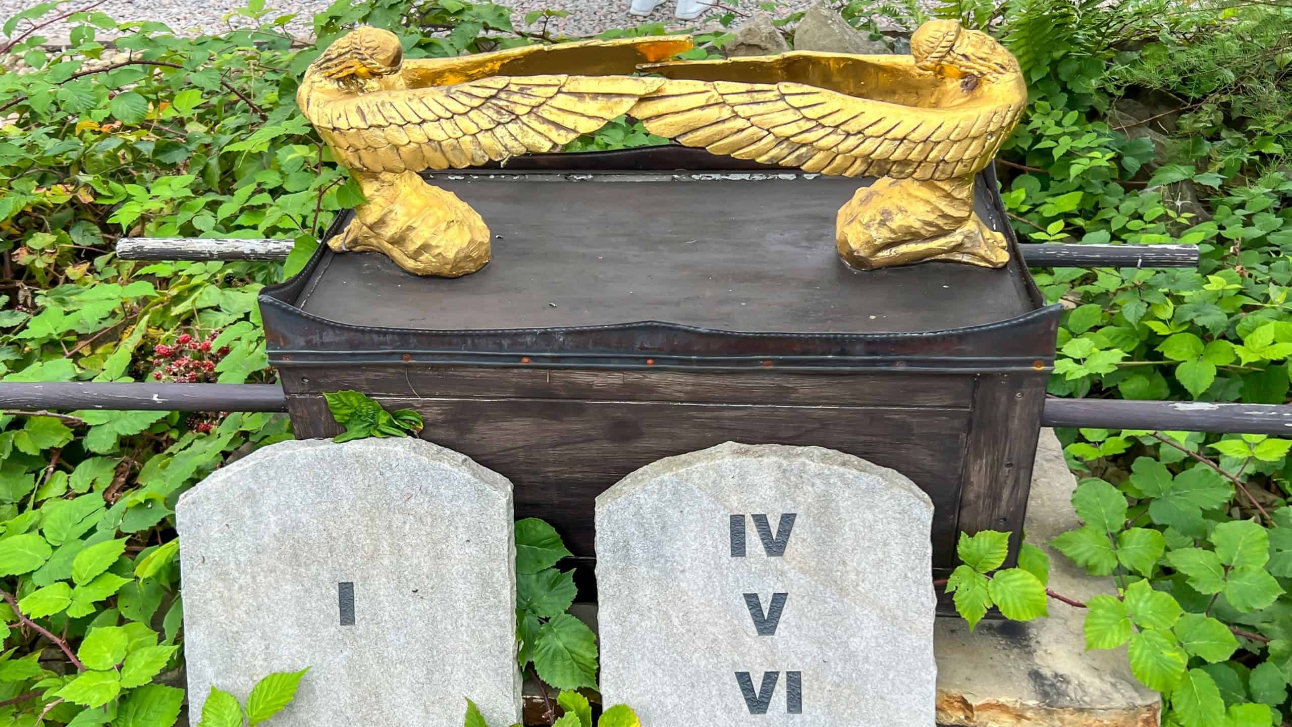Biblical Garden in Muszyna, Poland. Stone tablets with God's commandments and the ark of the covenant.