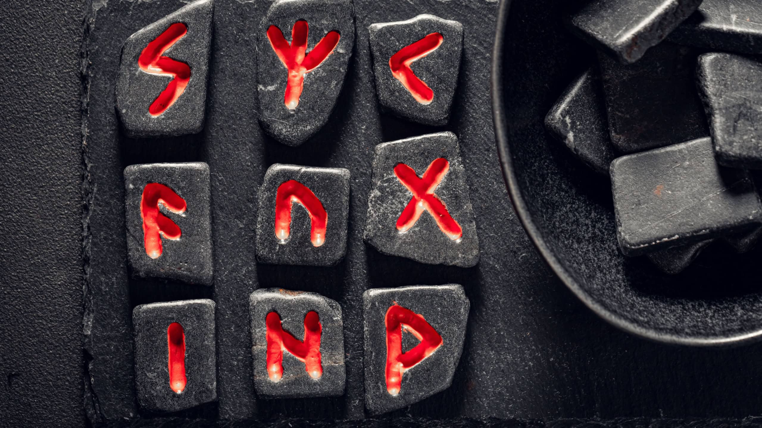 Closeup of strange divination by rune stones made of Celtic language as a mystical background