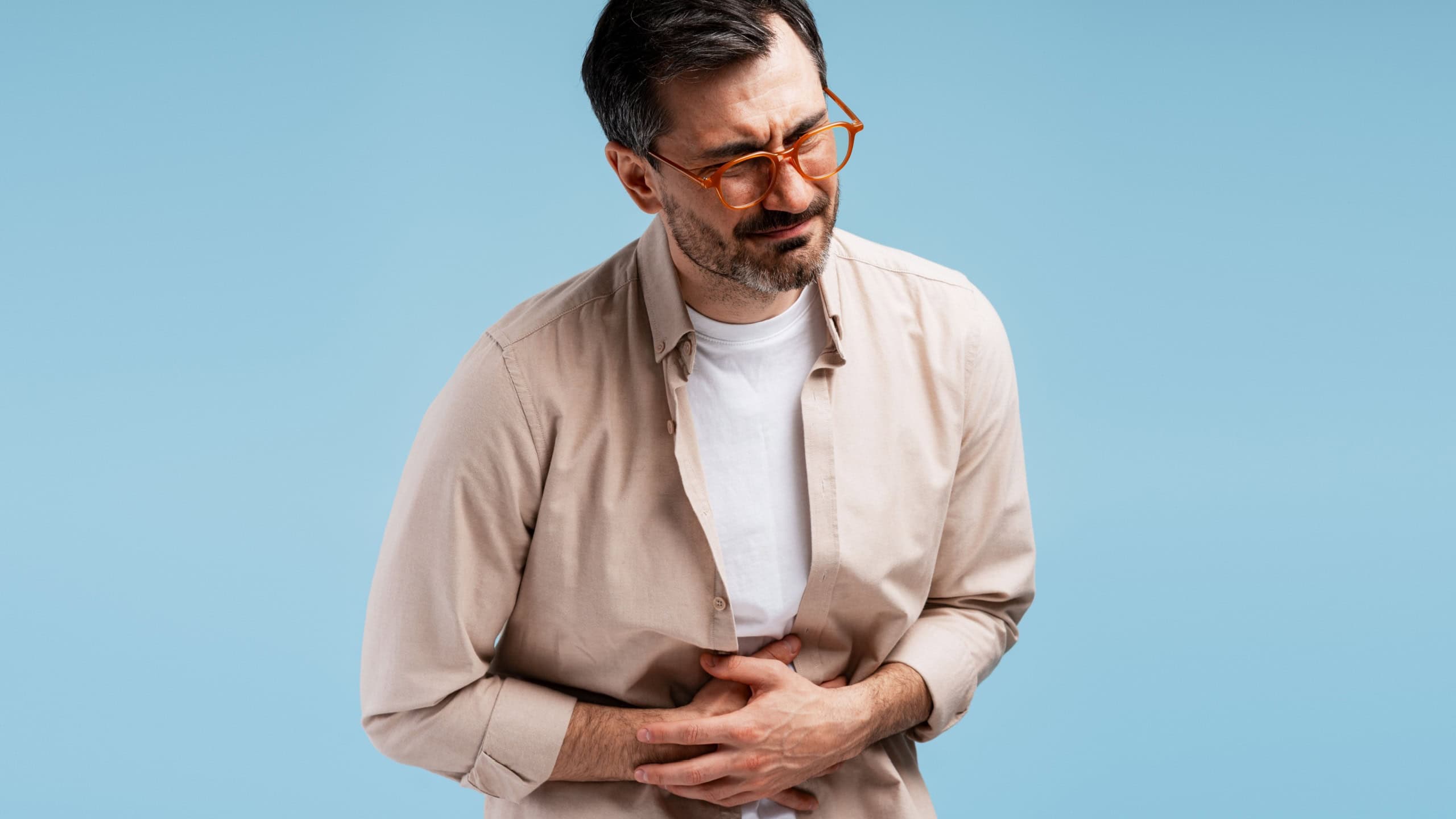 Man holding his stomach in pain