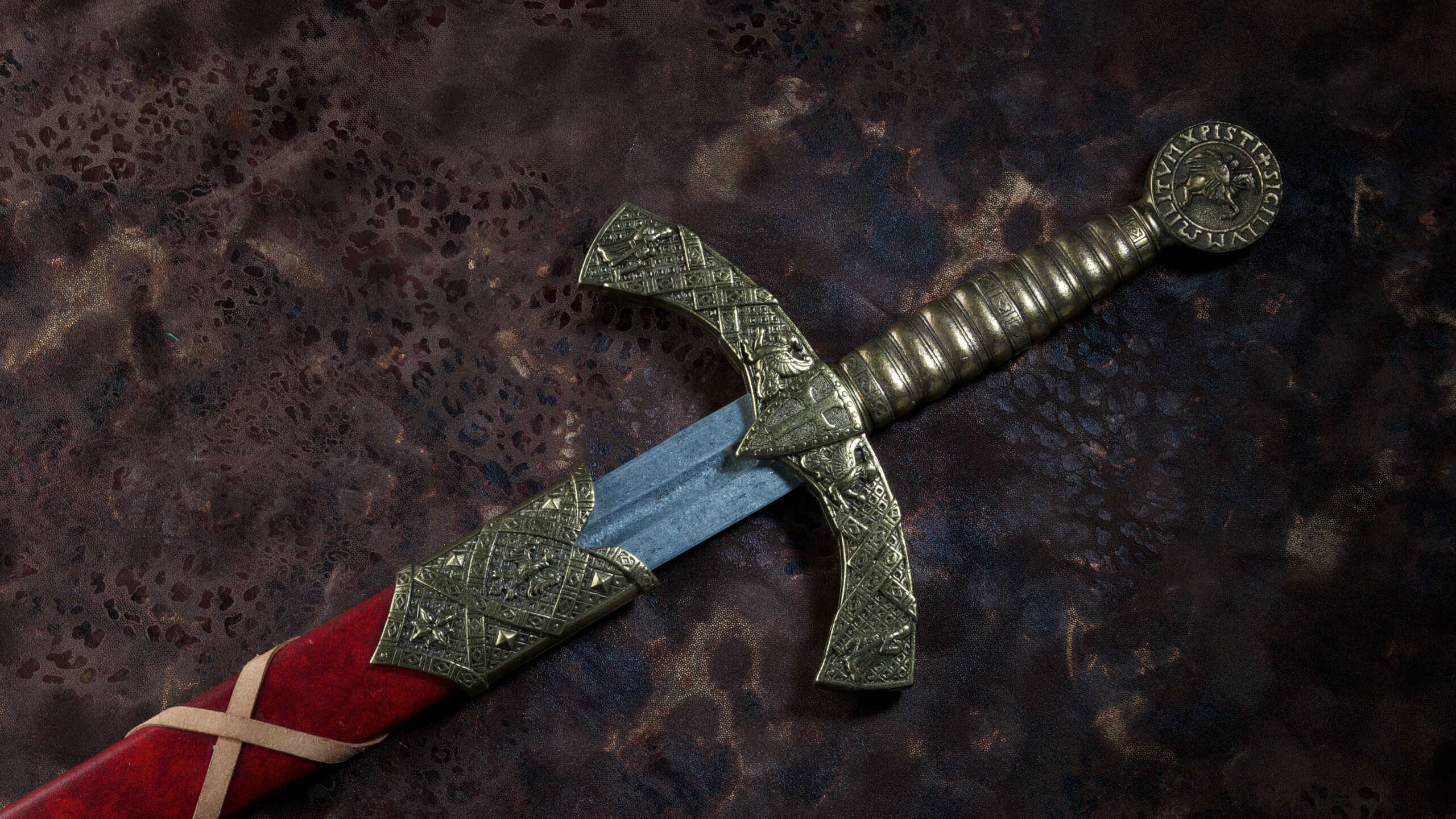 Ancient sword with the bronze hand holdon a beautiful background