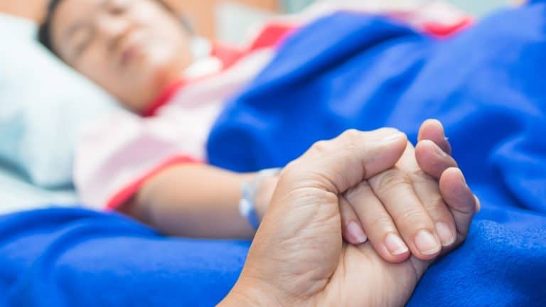 Holding patient hand