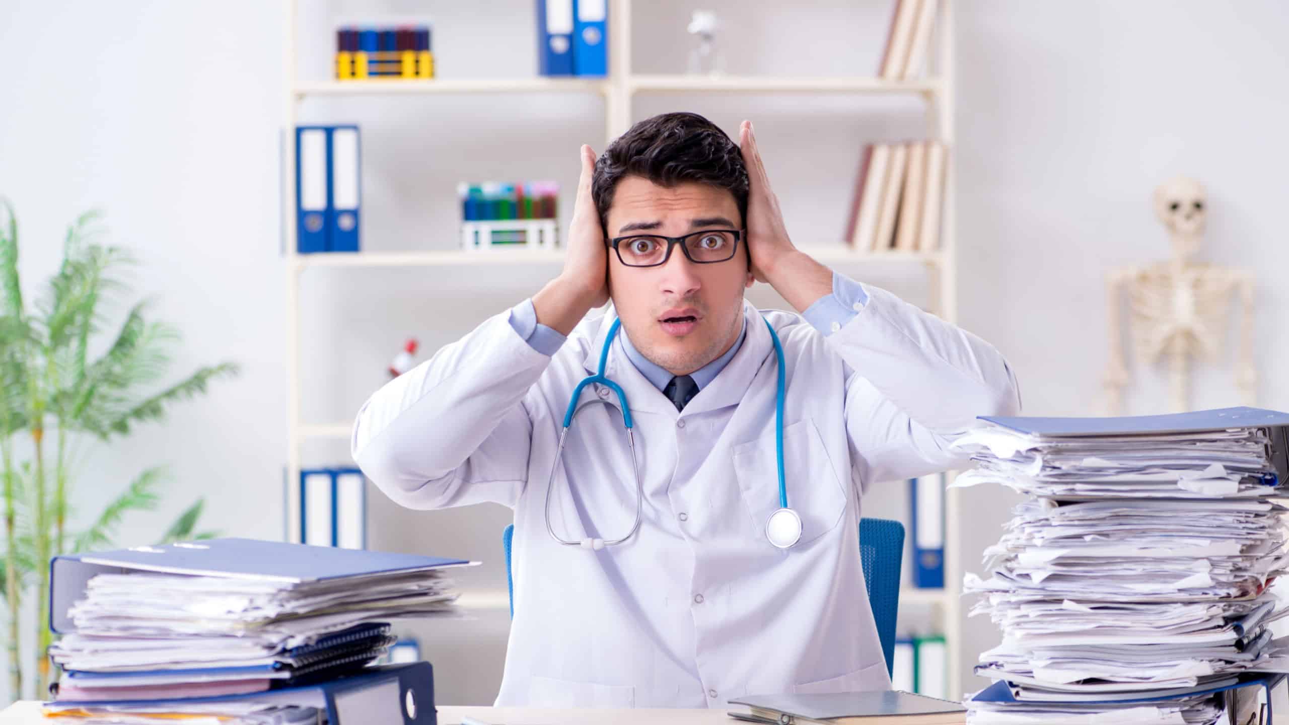 Busy doctor with too much work in hospital