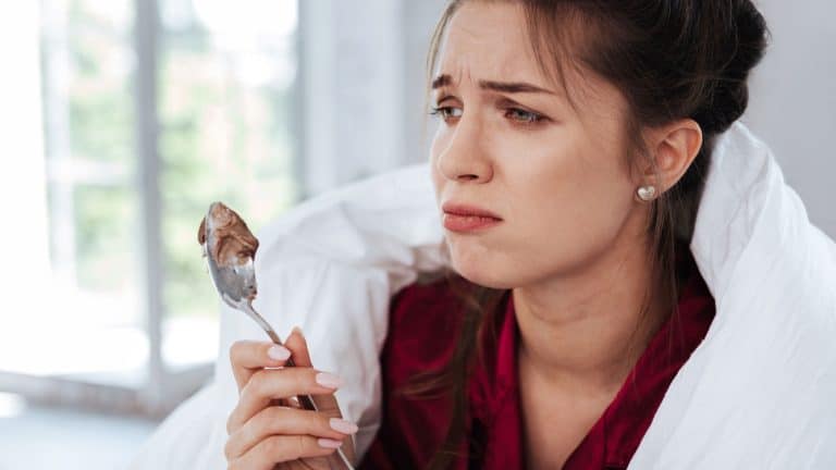 Heartbroken woman. Green-eyed heartbroken woman feeling very terrible after not getting desired promotion at work