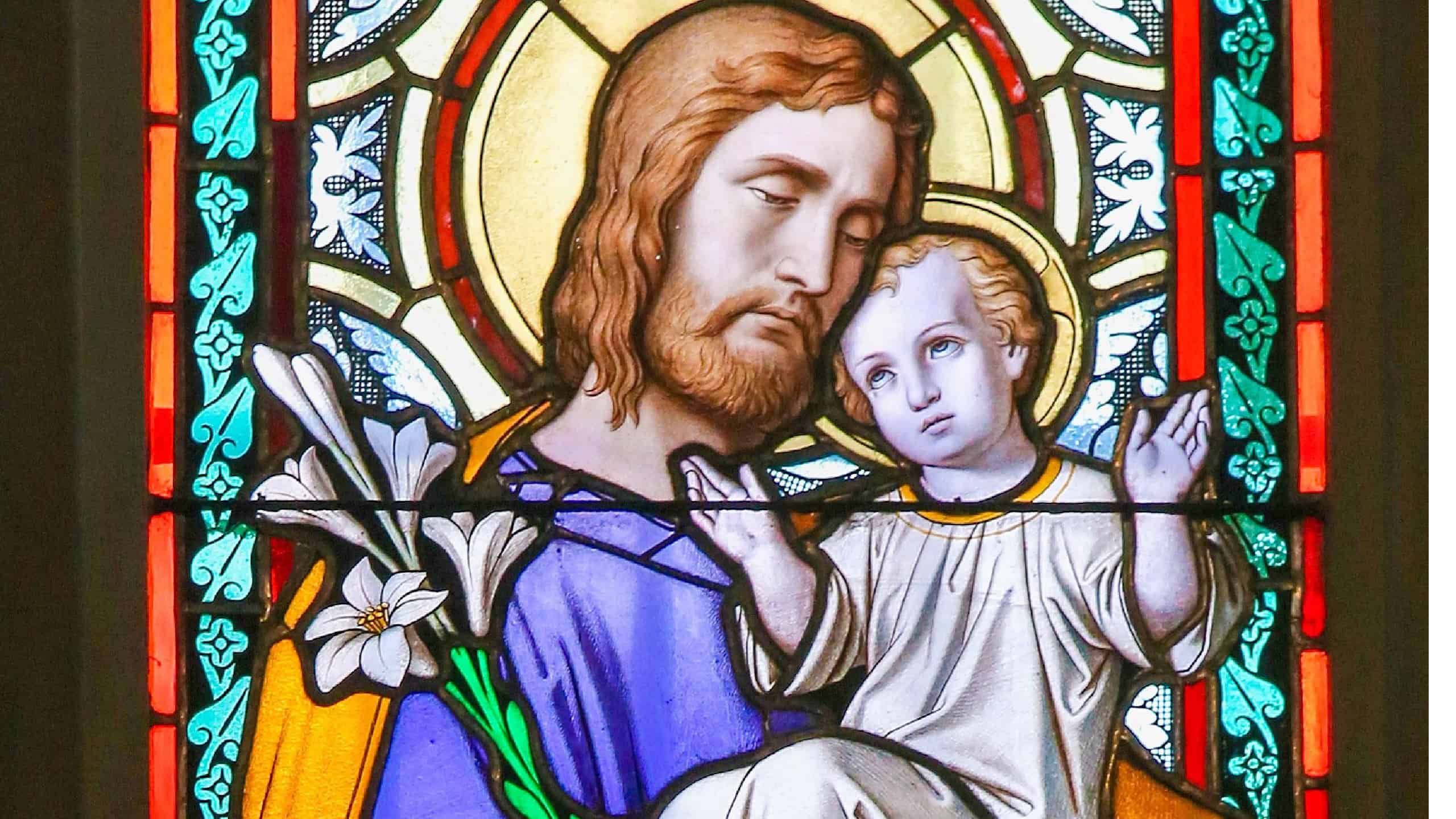 Prague, Czech Republic - April 2, 2016: Stained Glass window in St. Vitus Cathedral, Prague, depicting Saint Joseph and the Child Jesus