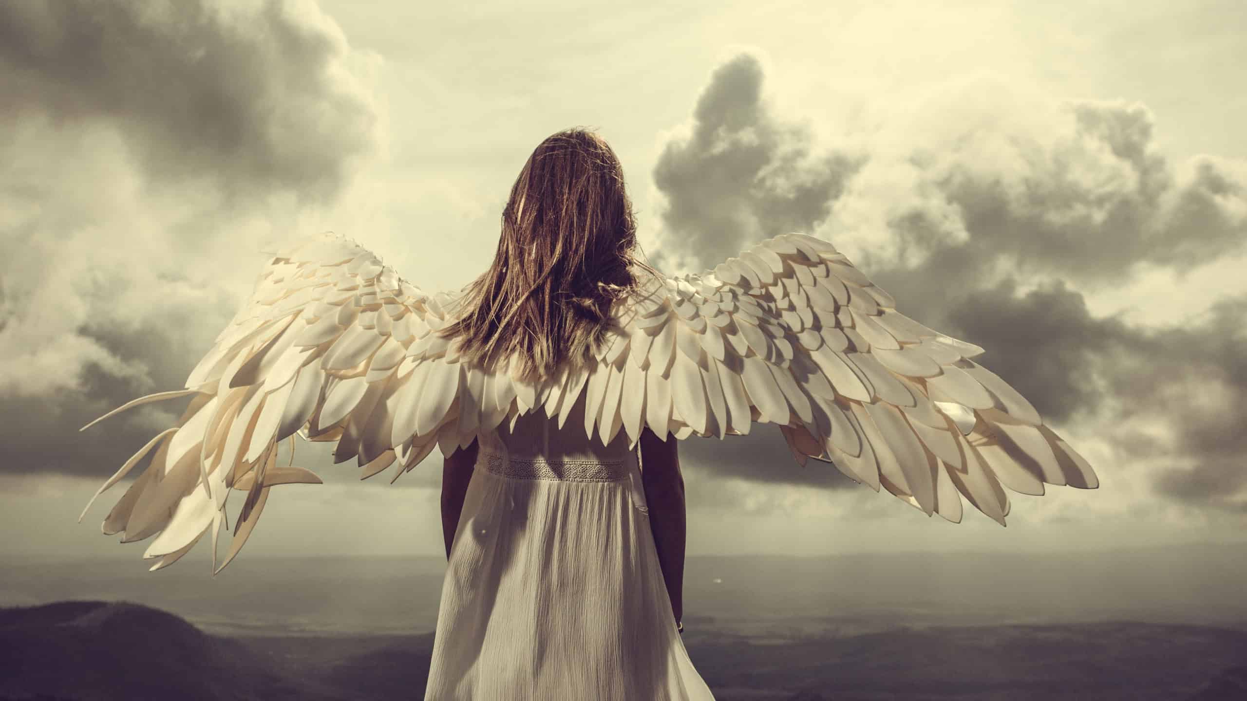 Beautiful angel among golden dust