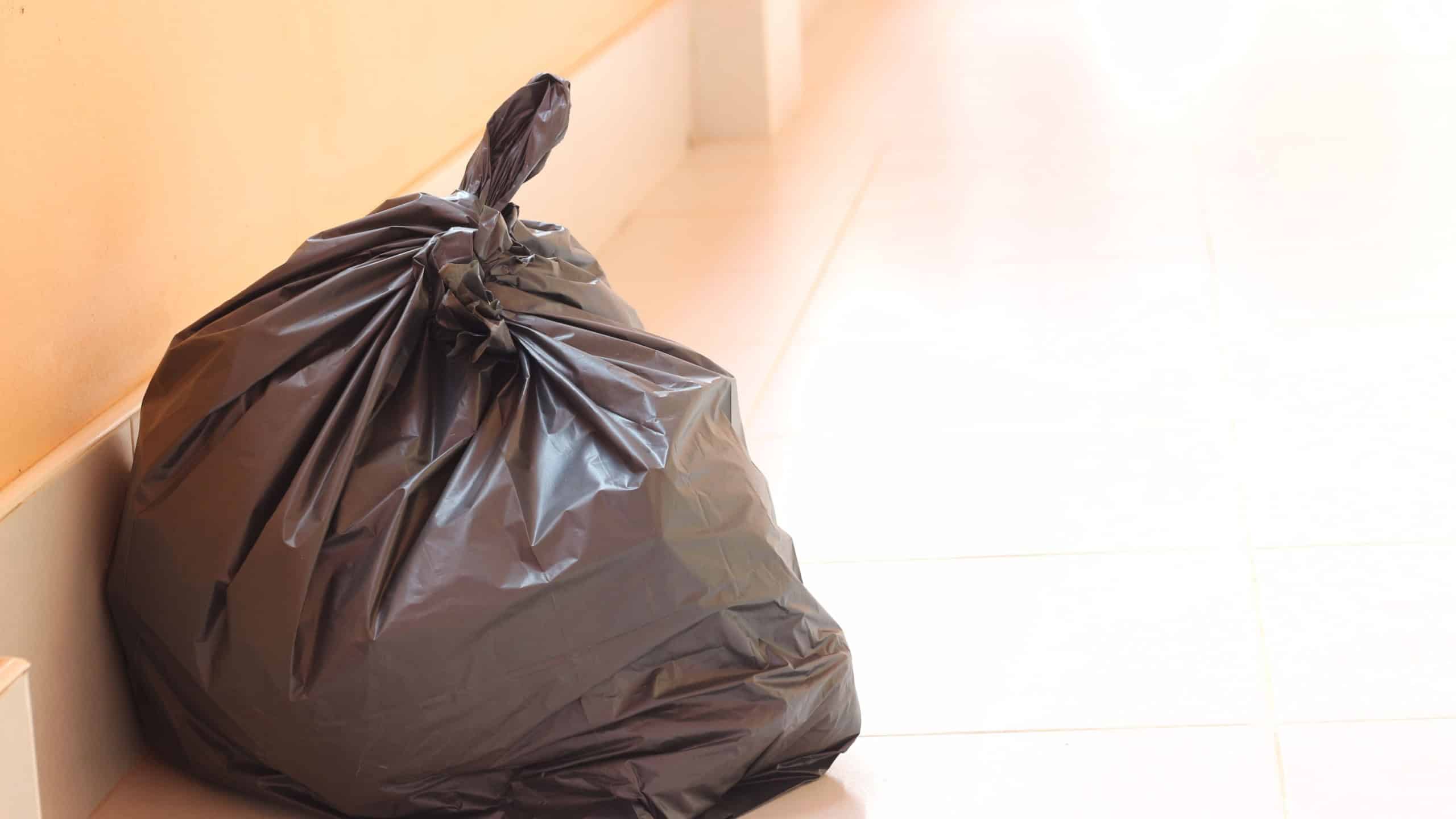 Black garbage bag in front of the room.