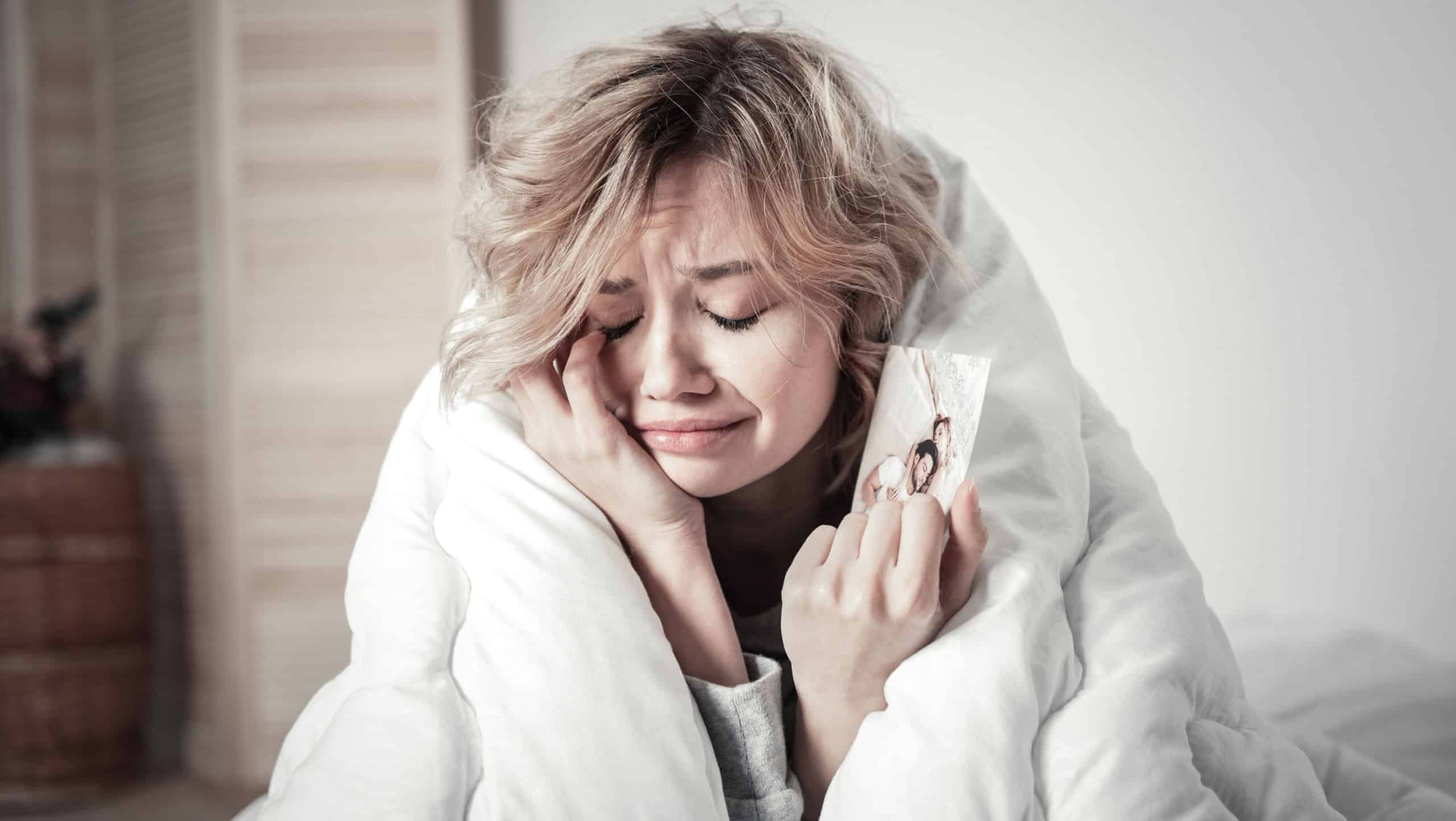 Woman crying. Sentimental emotional woman crying while remembering her relationship with ex boyfriend