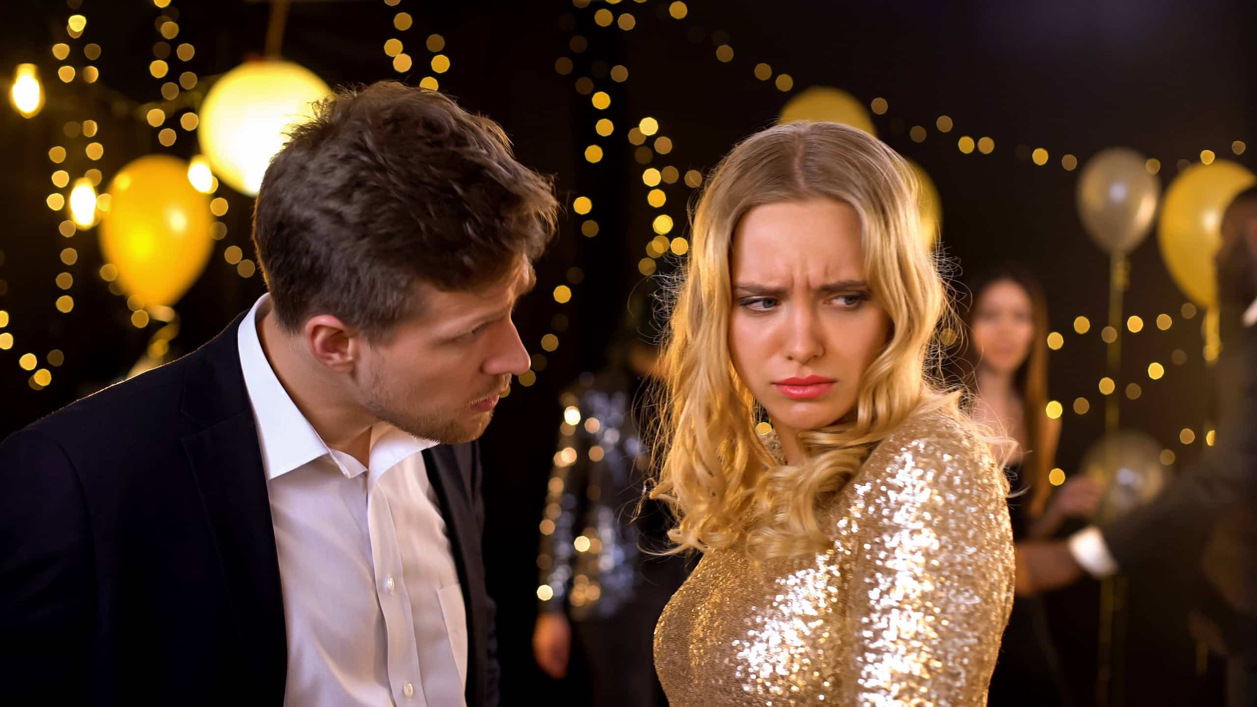 Angry young man scolding girlfriend celebration event, couple arguing, jealousy