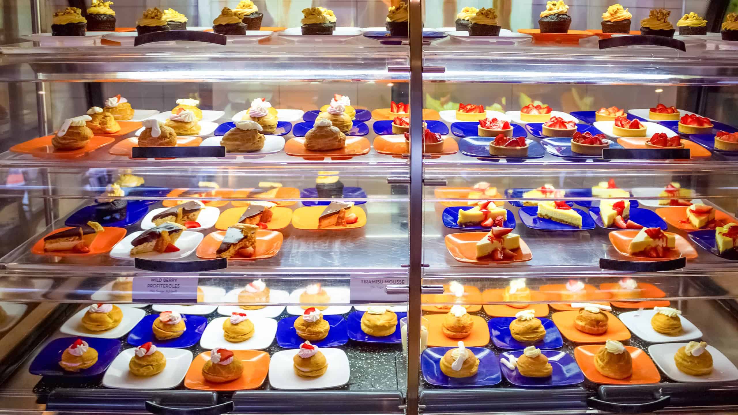 The kitchen aboard the abstract luxury cruise ship. Cakes with blackberry for Dining Room Buffet