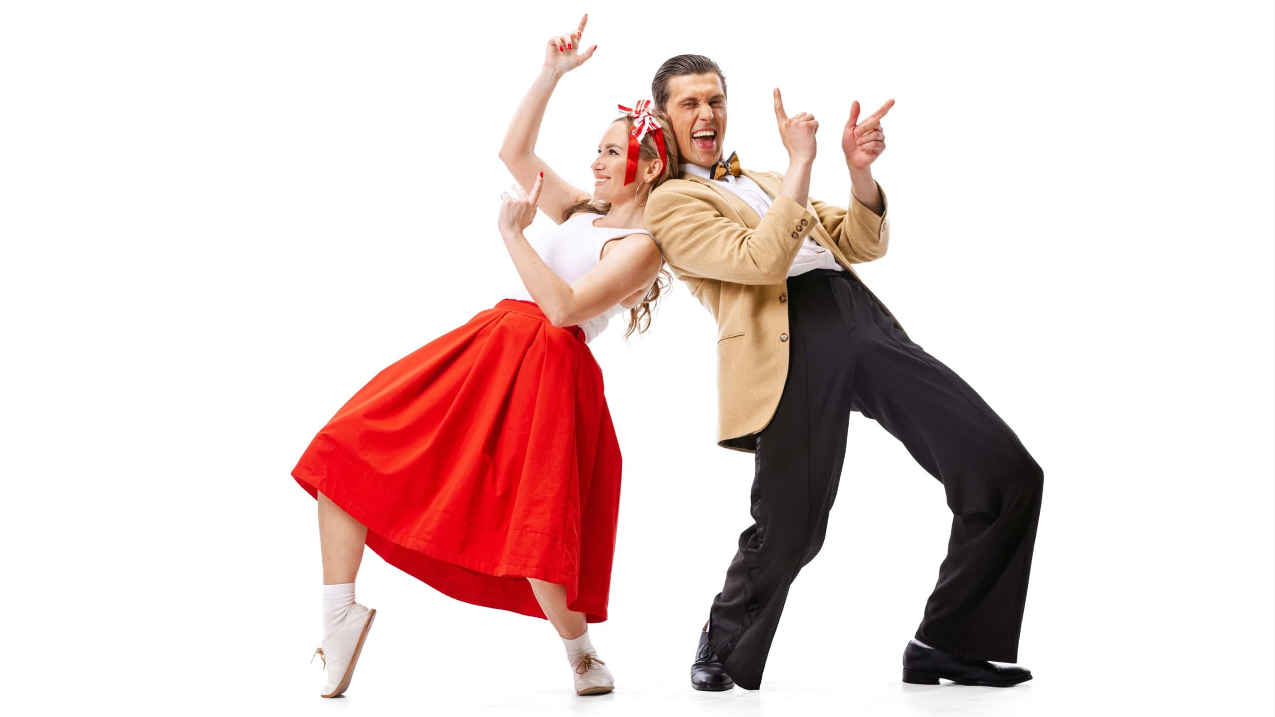 Expressive couple of dancers in vintage retro style outfits dancing social dance isolated on white background.