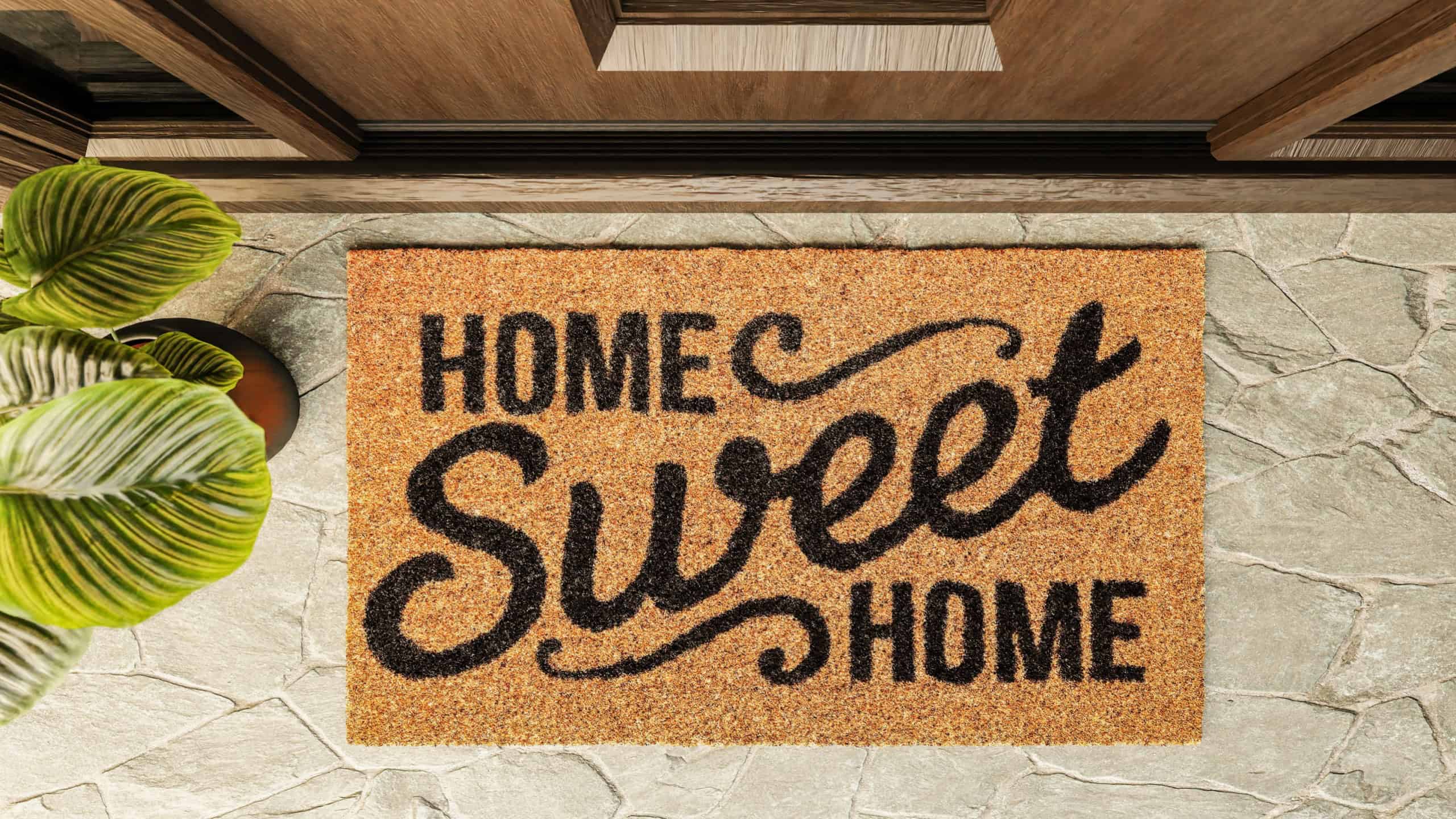 Home Sweet Home doormat on the porch at the front door.