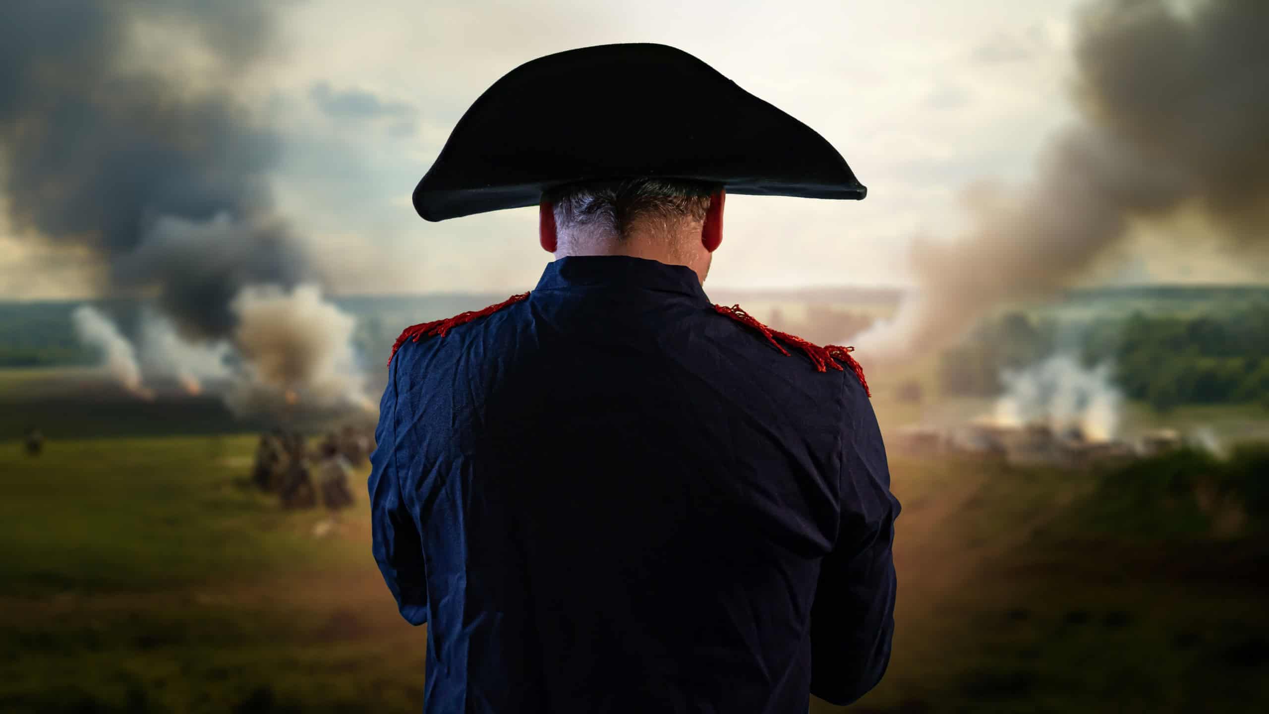 the historical portrait of Napoleon Bonaparte on background of the battlefield