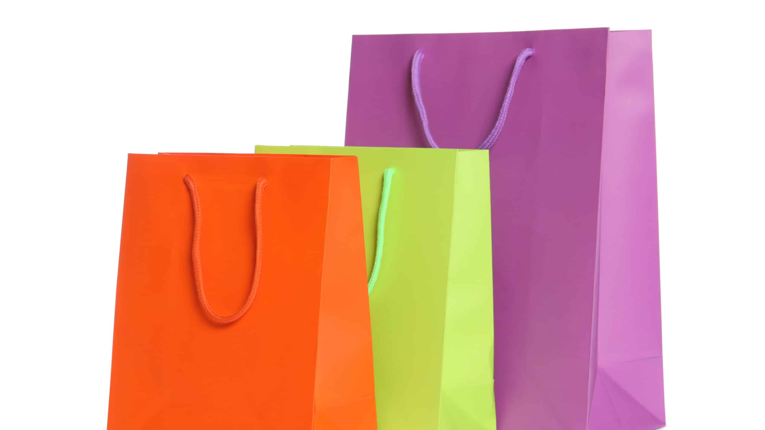 Colorful paper shopping bags isolated on white