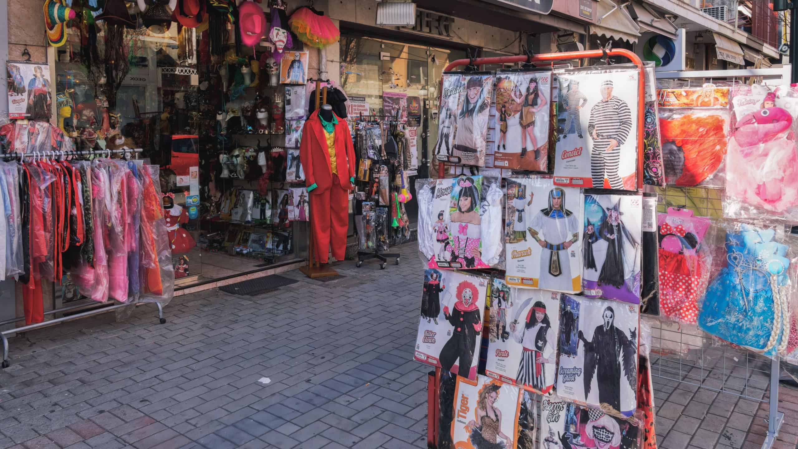 Shop selling hats, carnival masks and costumes window showcase