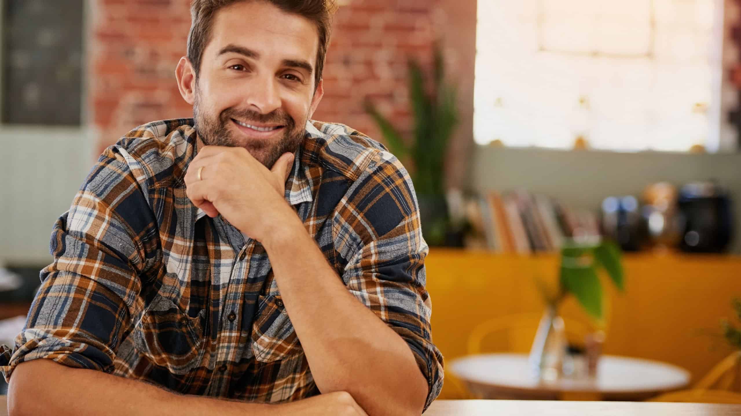 Coffee shop, happy and portrait of man with confidence, pride and smile