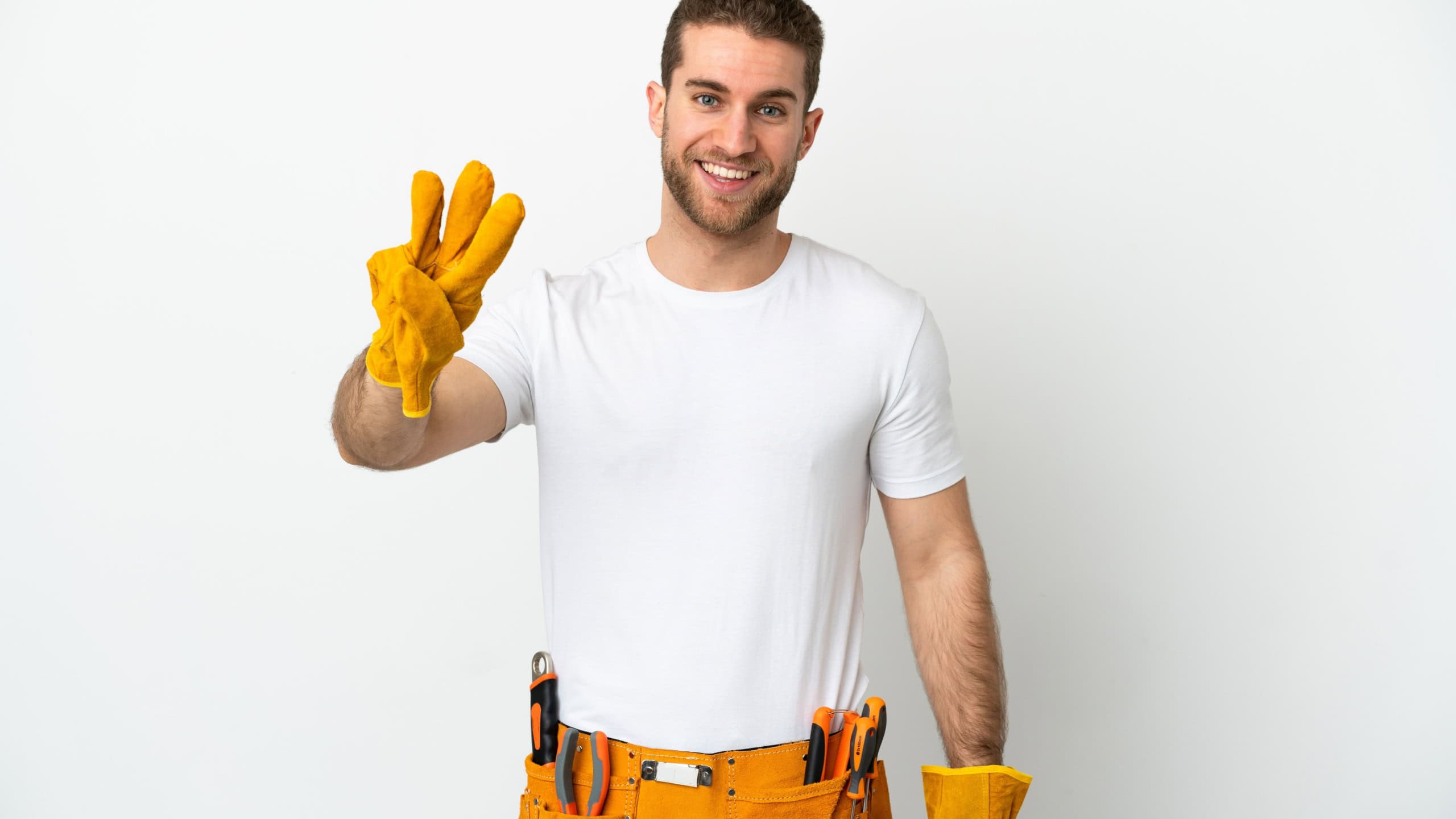 Young electrician man over isolated white wall happy and counting three with fingers